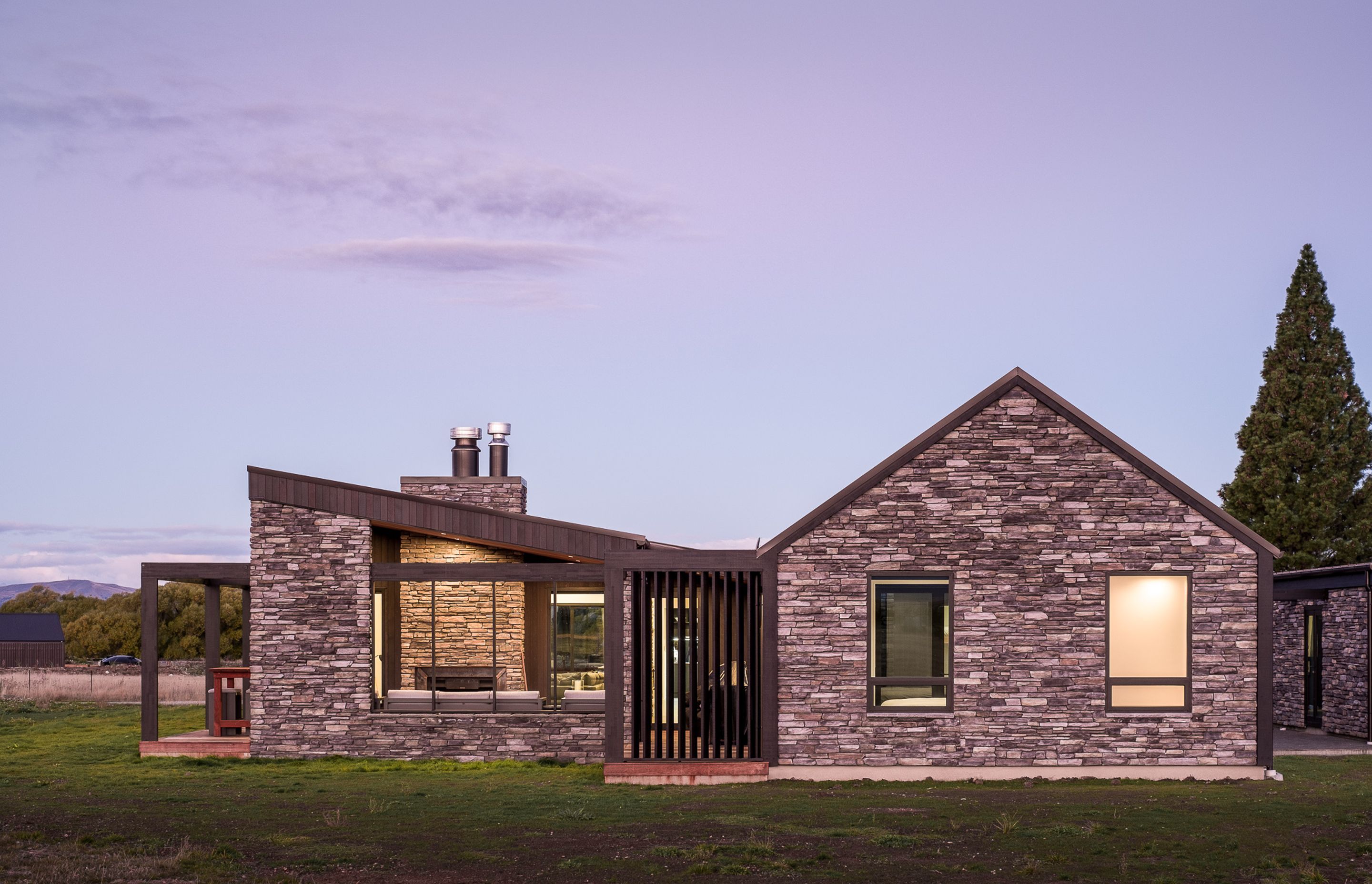 The western elevation shows off the mix between traditional gable form and more contemporary monopitch roofline.