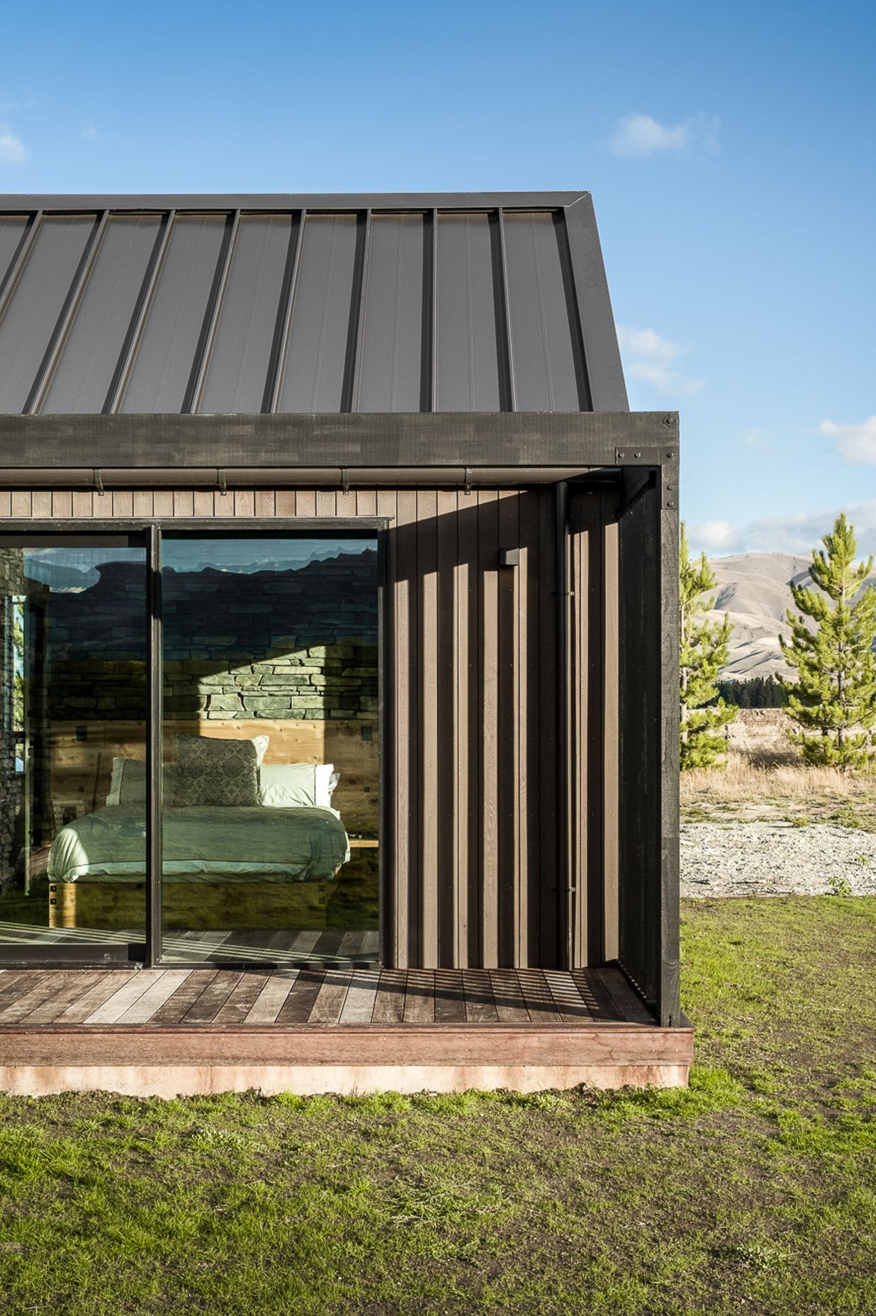 Various deck areas around the home are screened for wind protection and privacy, while allowing sunlight to filter through into the interior.