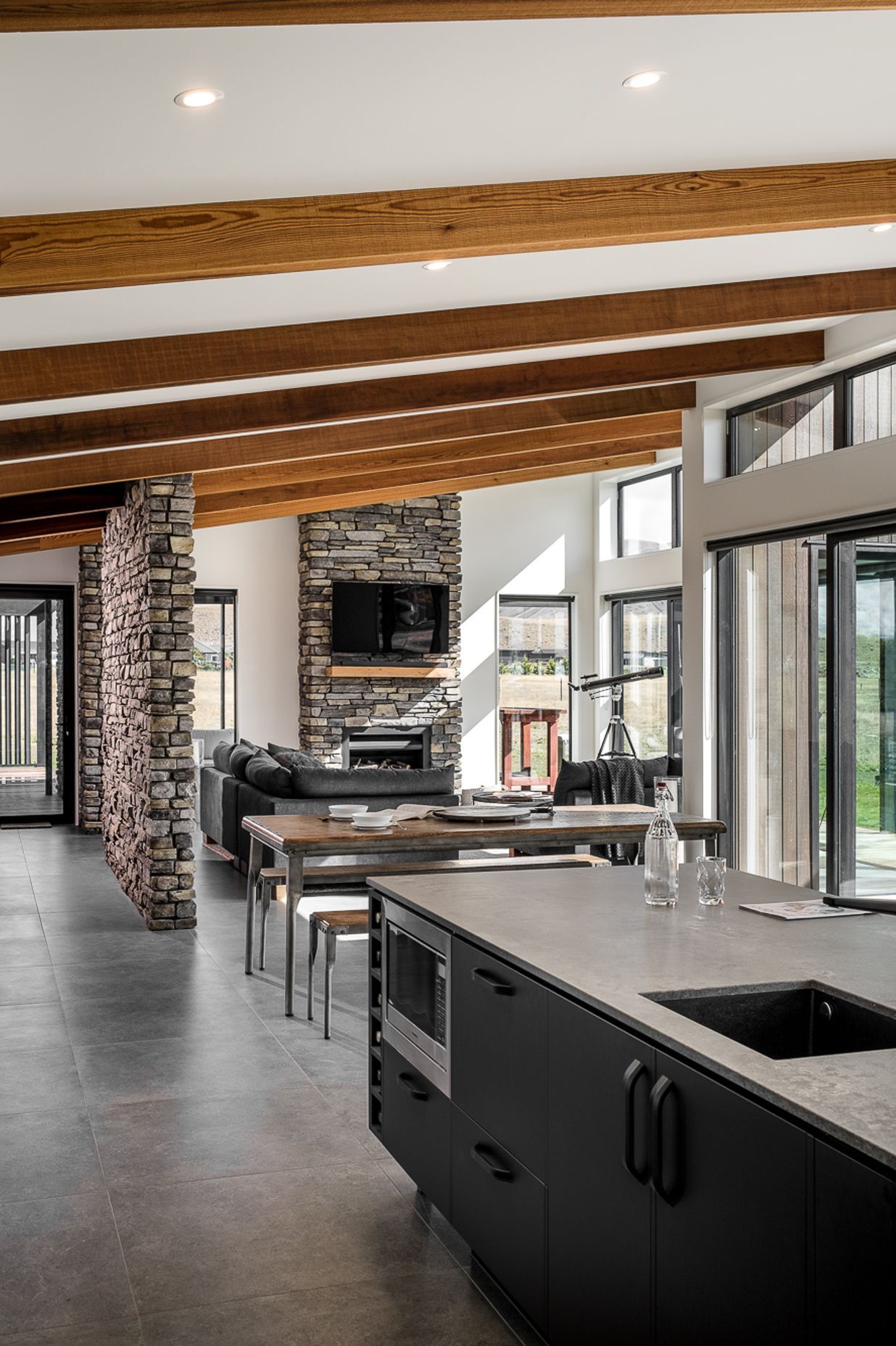 The main living, kitchen and dining spaces are located to the front and open out to the main view.
