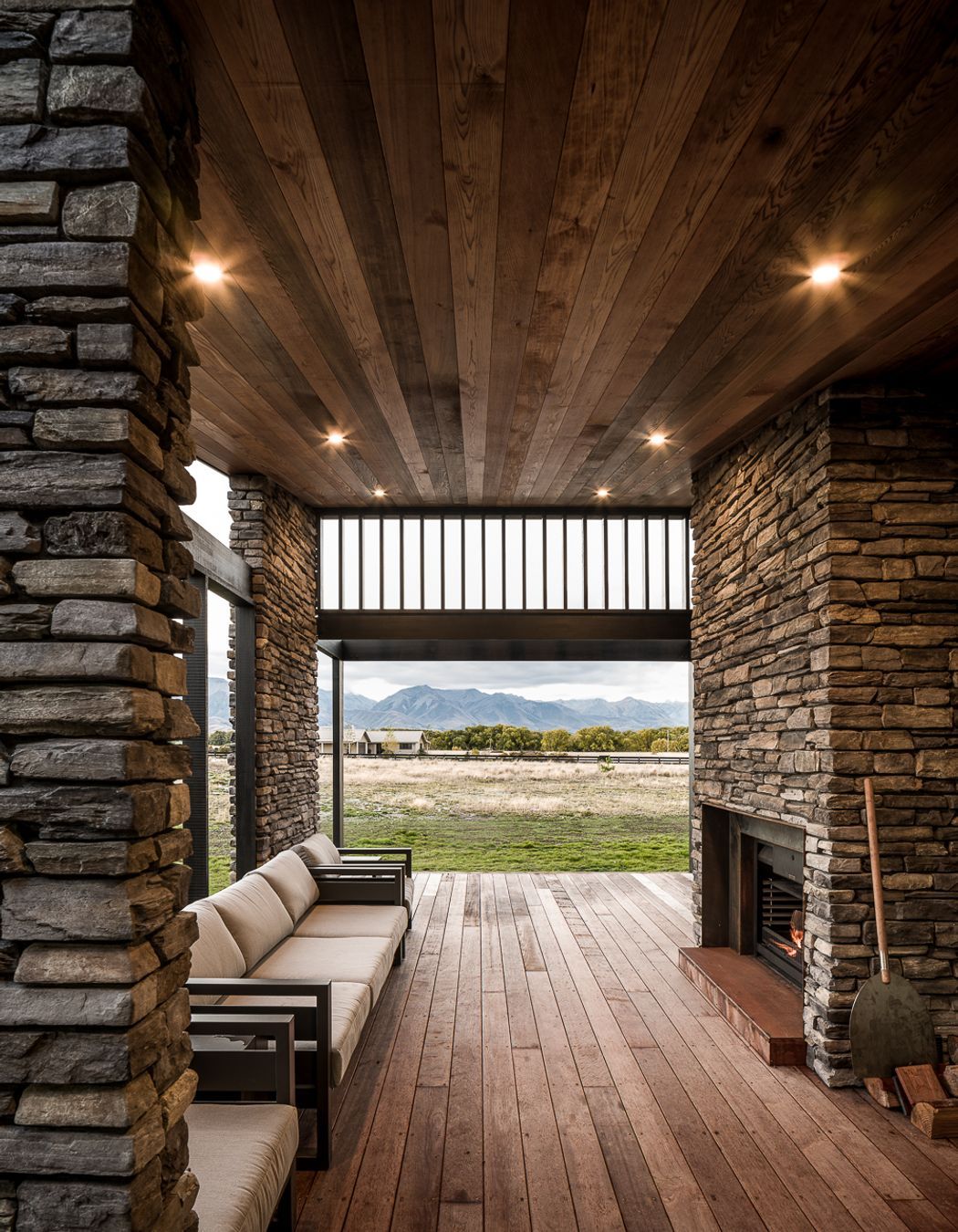 The stone walls, coupled with timber floor and ceiling, add a further dimension of warmth to the evening terrace.