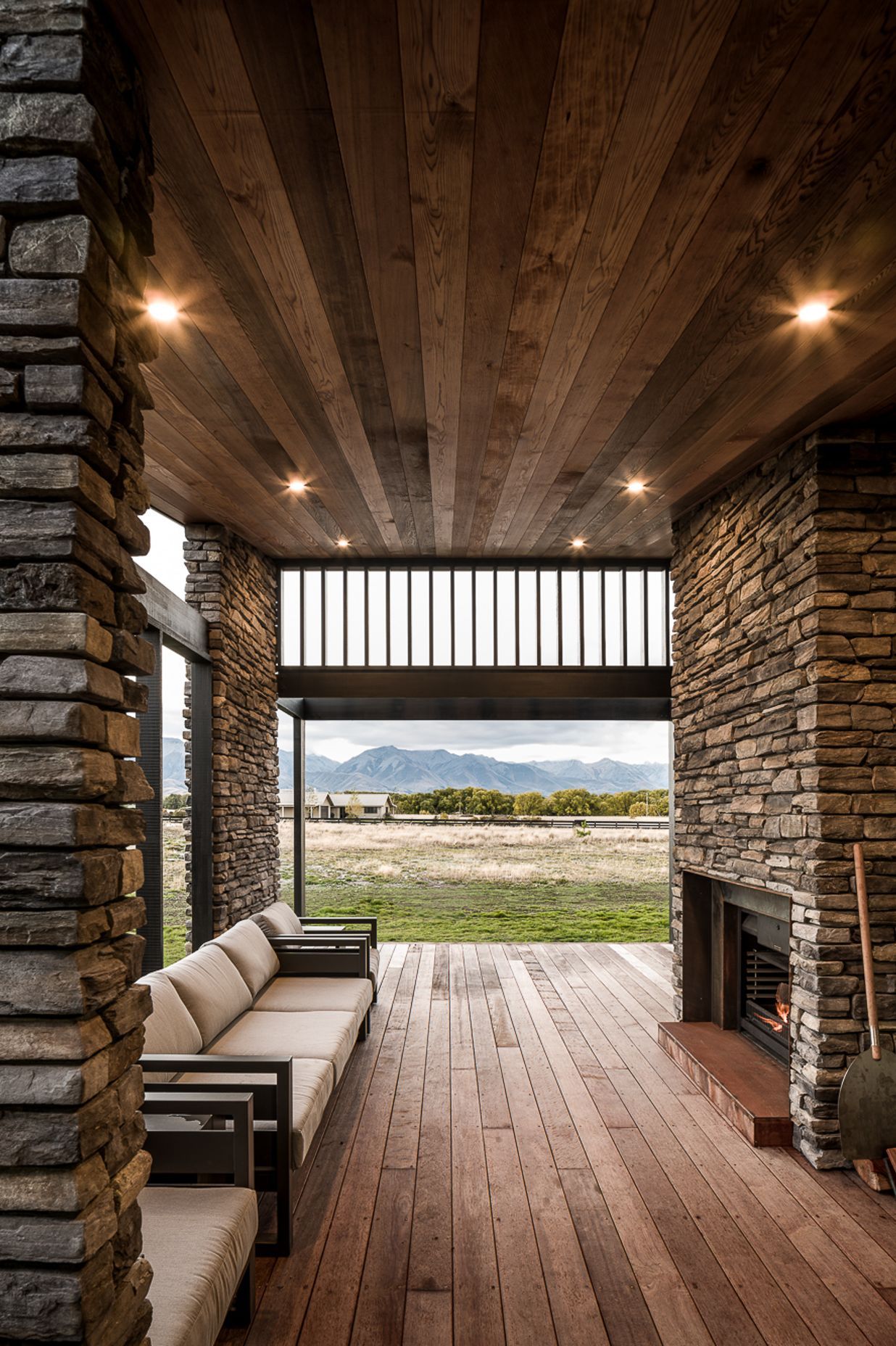 The stone walls, coupled with timber floor and ceiling, add a further dimension of warmth to the evening terrace.