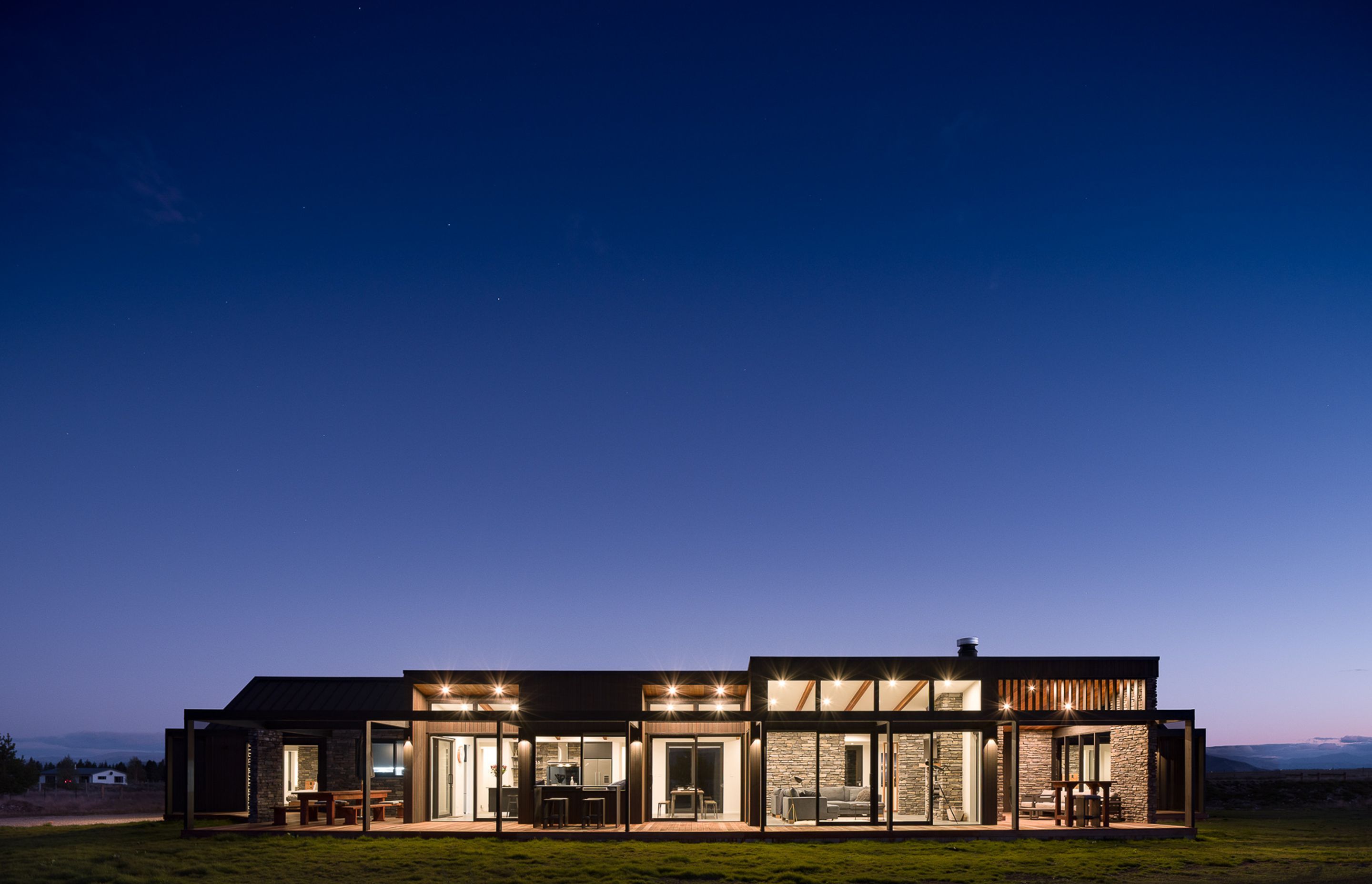 A huge deck runs the full length of the living spaces and allows for seamless indoor-outdoor entertaining at multiple points.