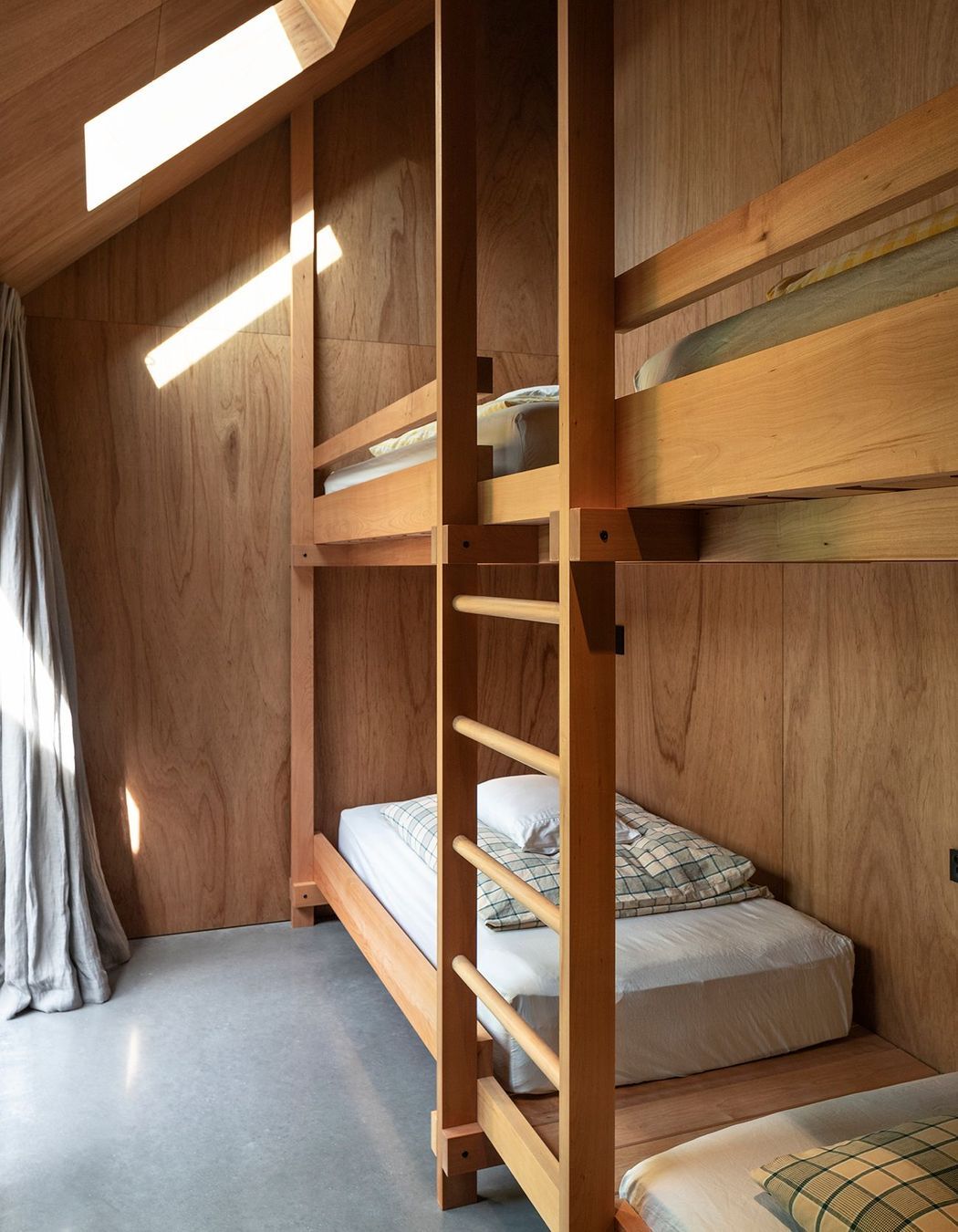 The beds in the bunkroom were beautiful detailed by the architects.