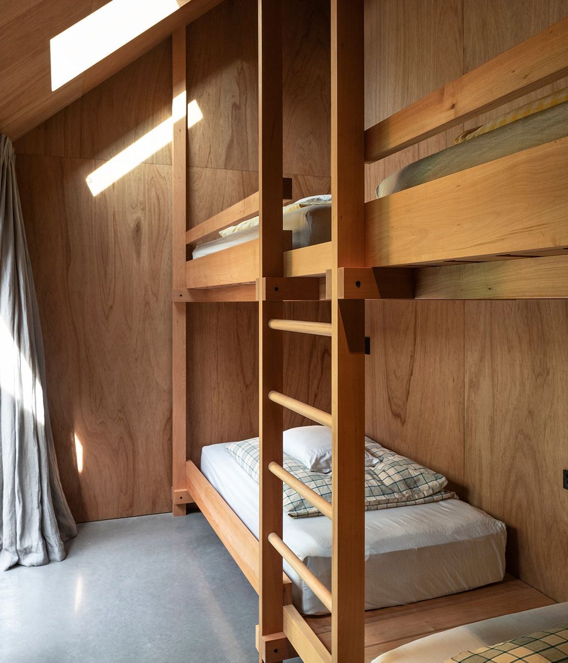 The beds in the bunkroom were beautiful detailed by the architects.