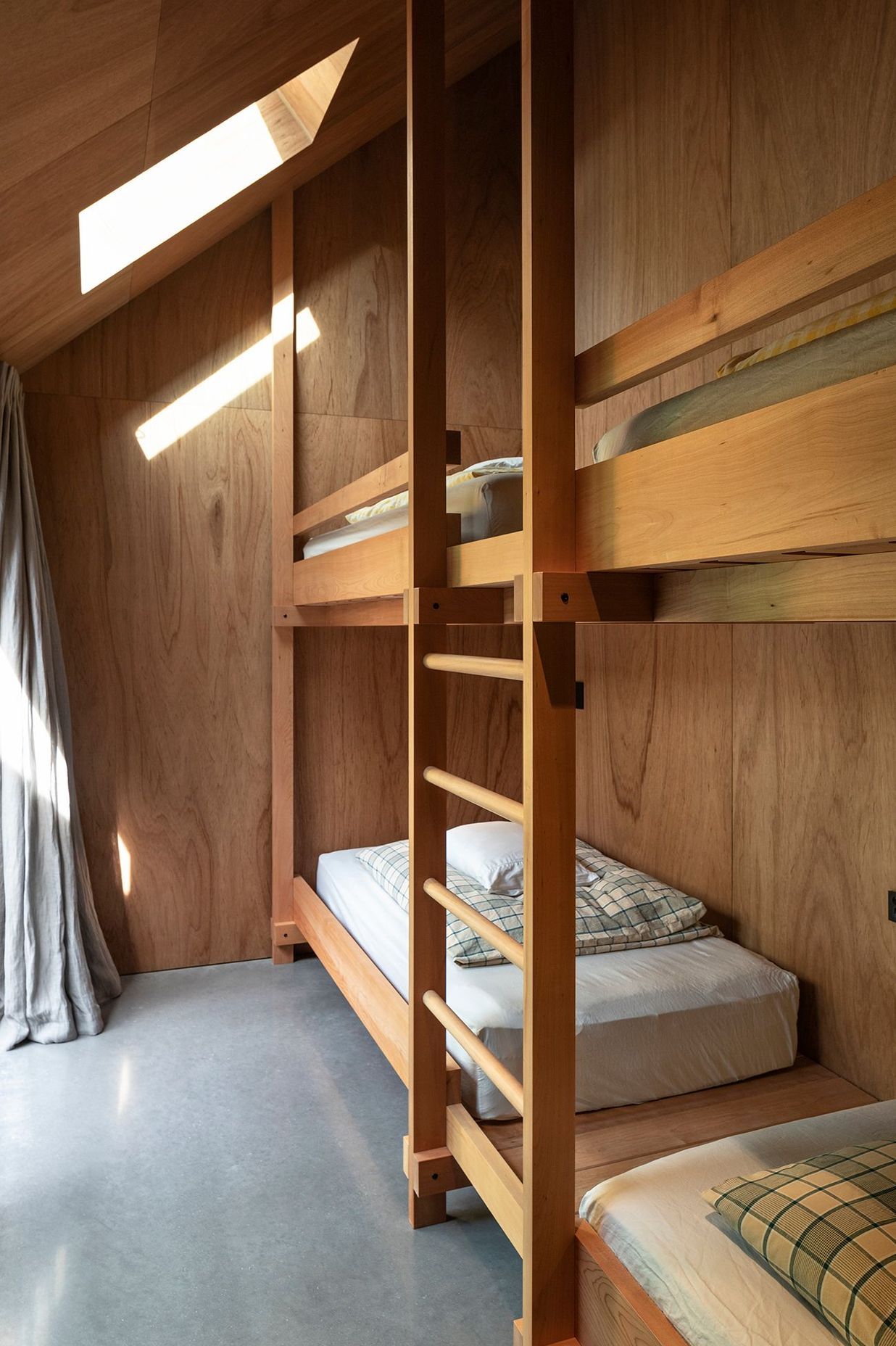 The beds in the bunkroom were beautiful detailed by the architects.