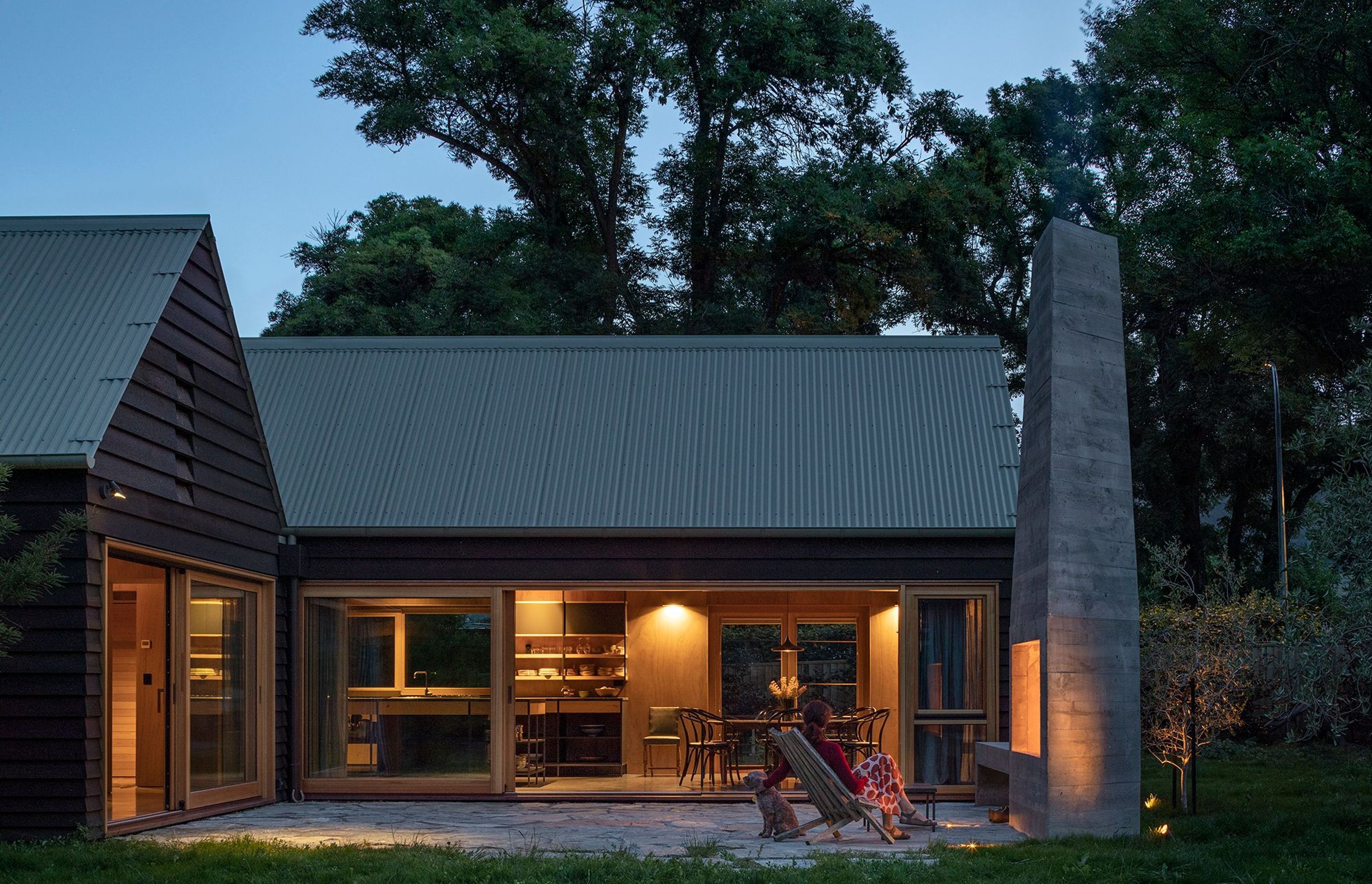 The main courtyard off the lounge (left) and the dining area (centre) has a large cast in-situ concrete fireplace for cooler nights.