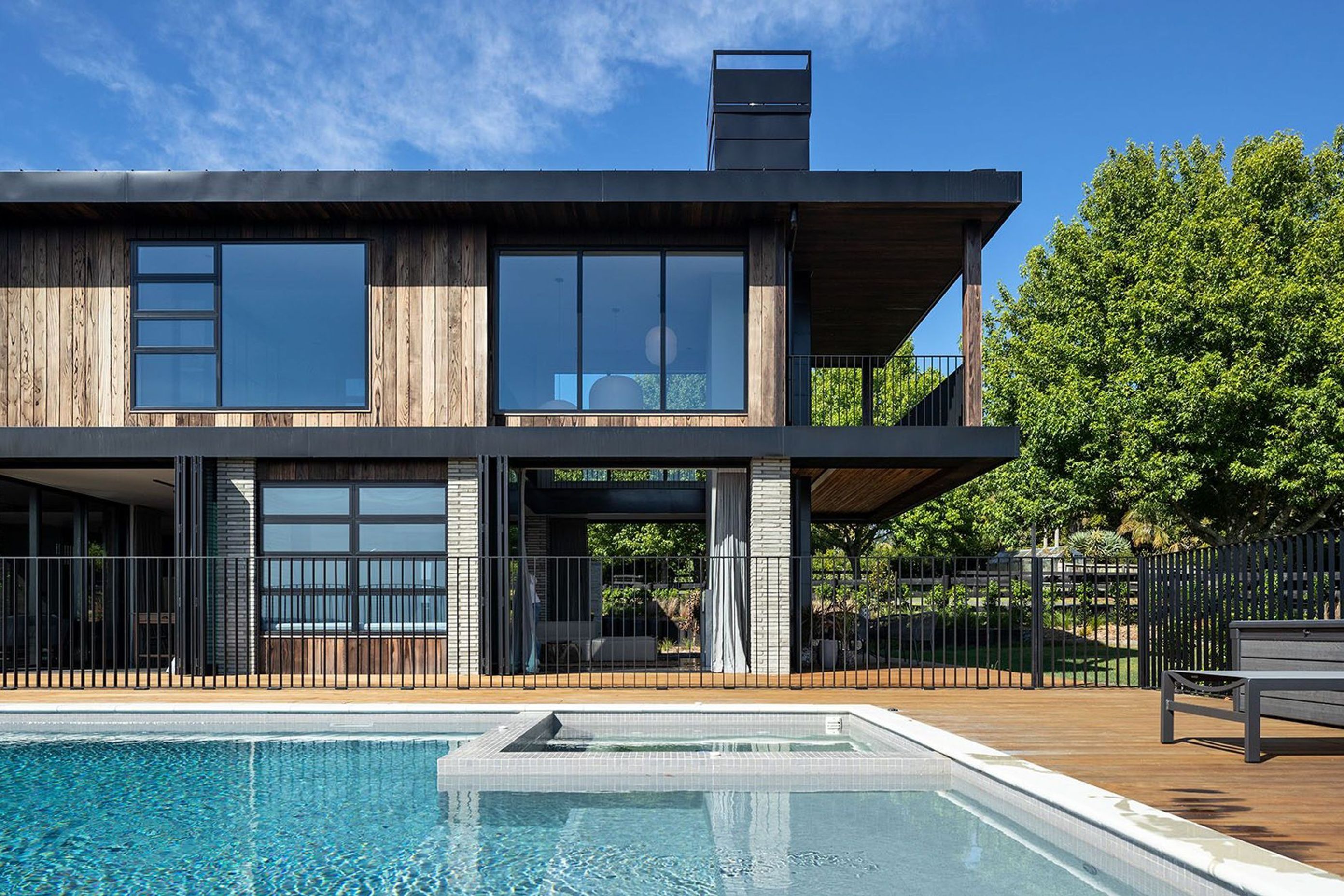 An infinity pool stretches out in front of the house, further affirming the directional gaze and connection with this rural coastal landscape. 