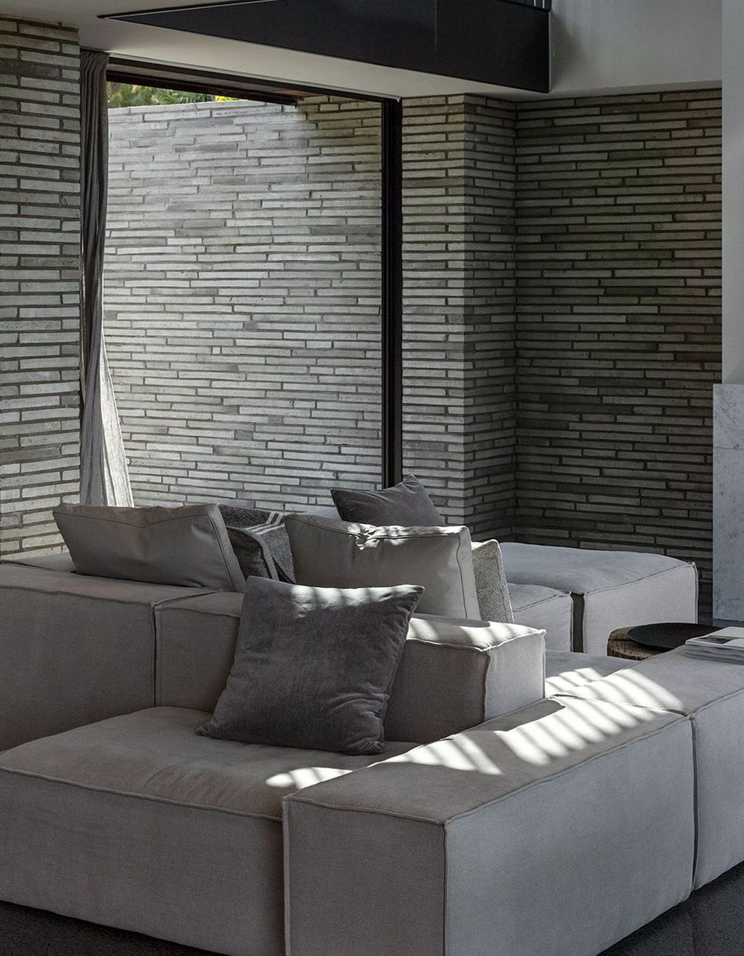 A muted colour palette gives way to a layering of texture and material to create a sense of calm.
