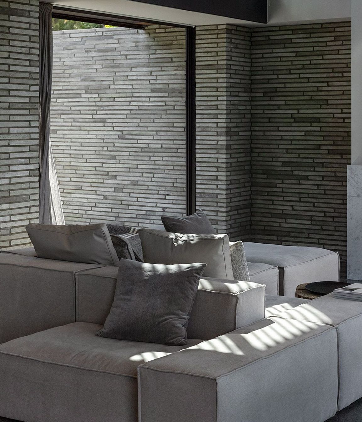 A muted colour palette gives way to a layering of texture and material to create a sense of calm.