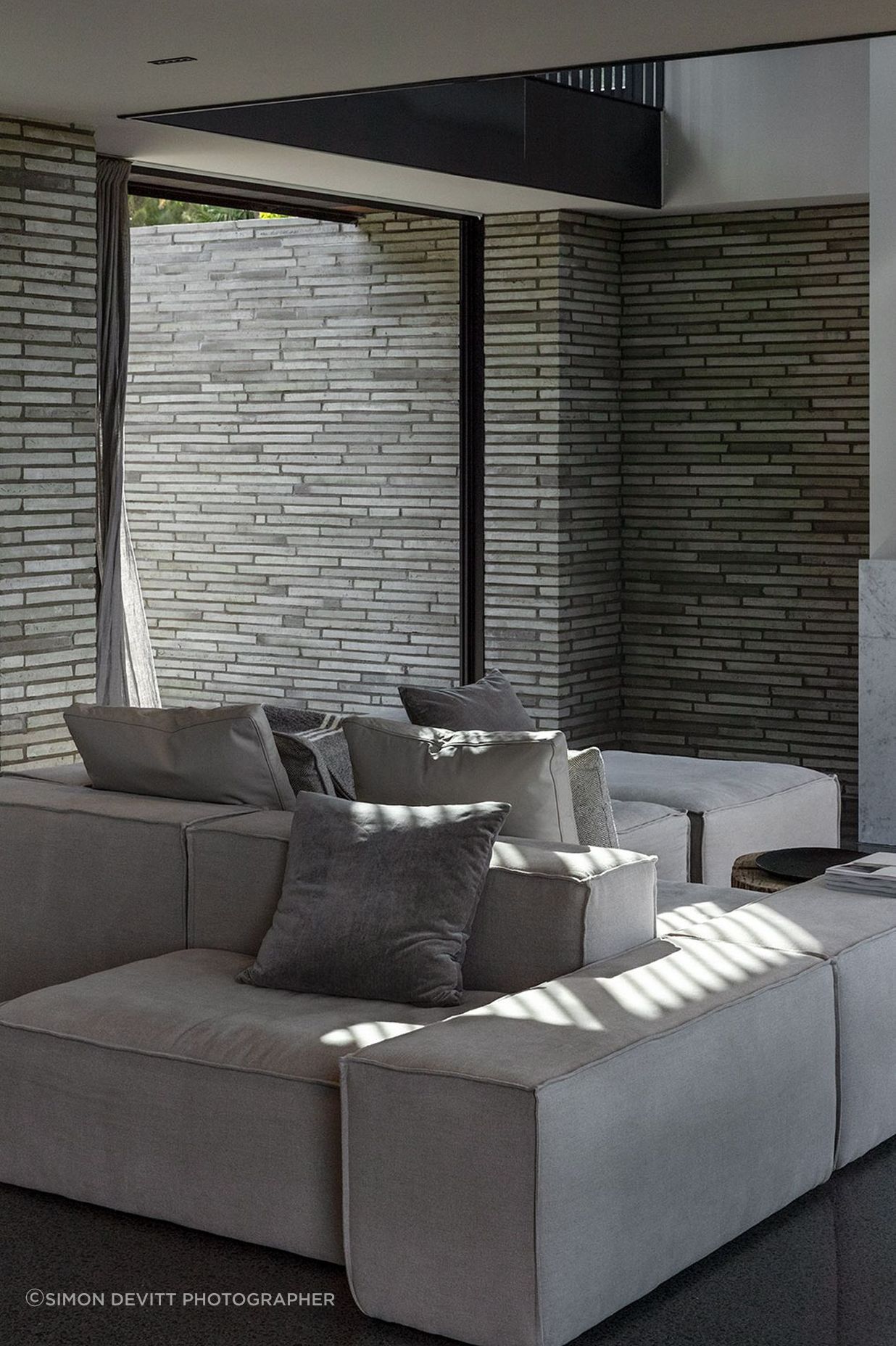 A muted colour palette gives way to a layering of texture and material to create a sense of calm.