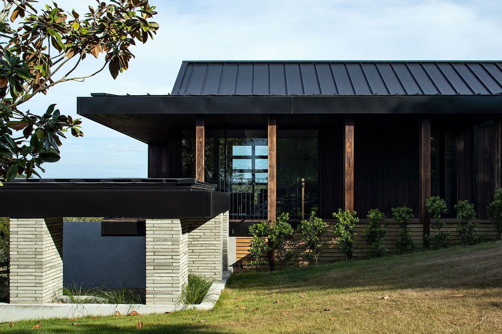 A cloistered walkway links the separate guest house (pictured above) with the main home.