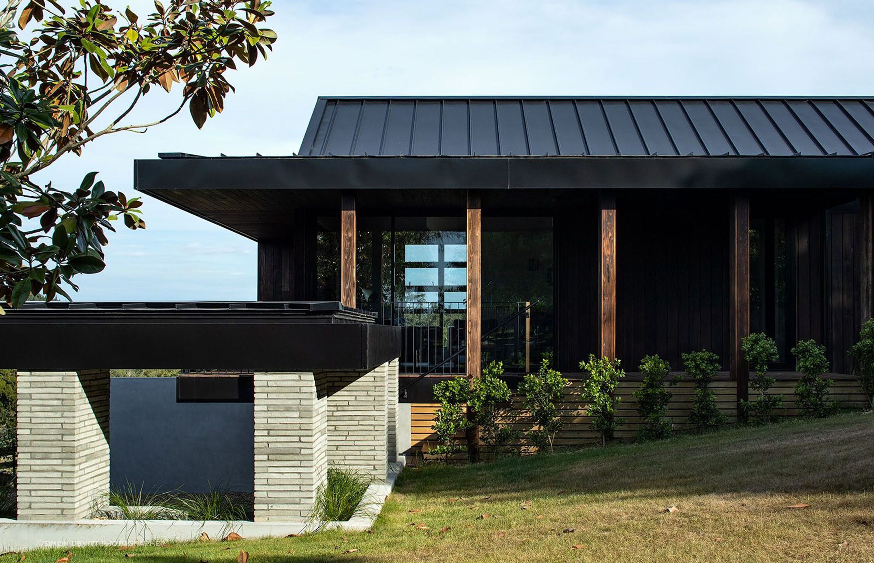 A cloistered walkway links the separate guest house (pictured above) with the main home.