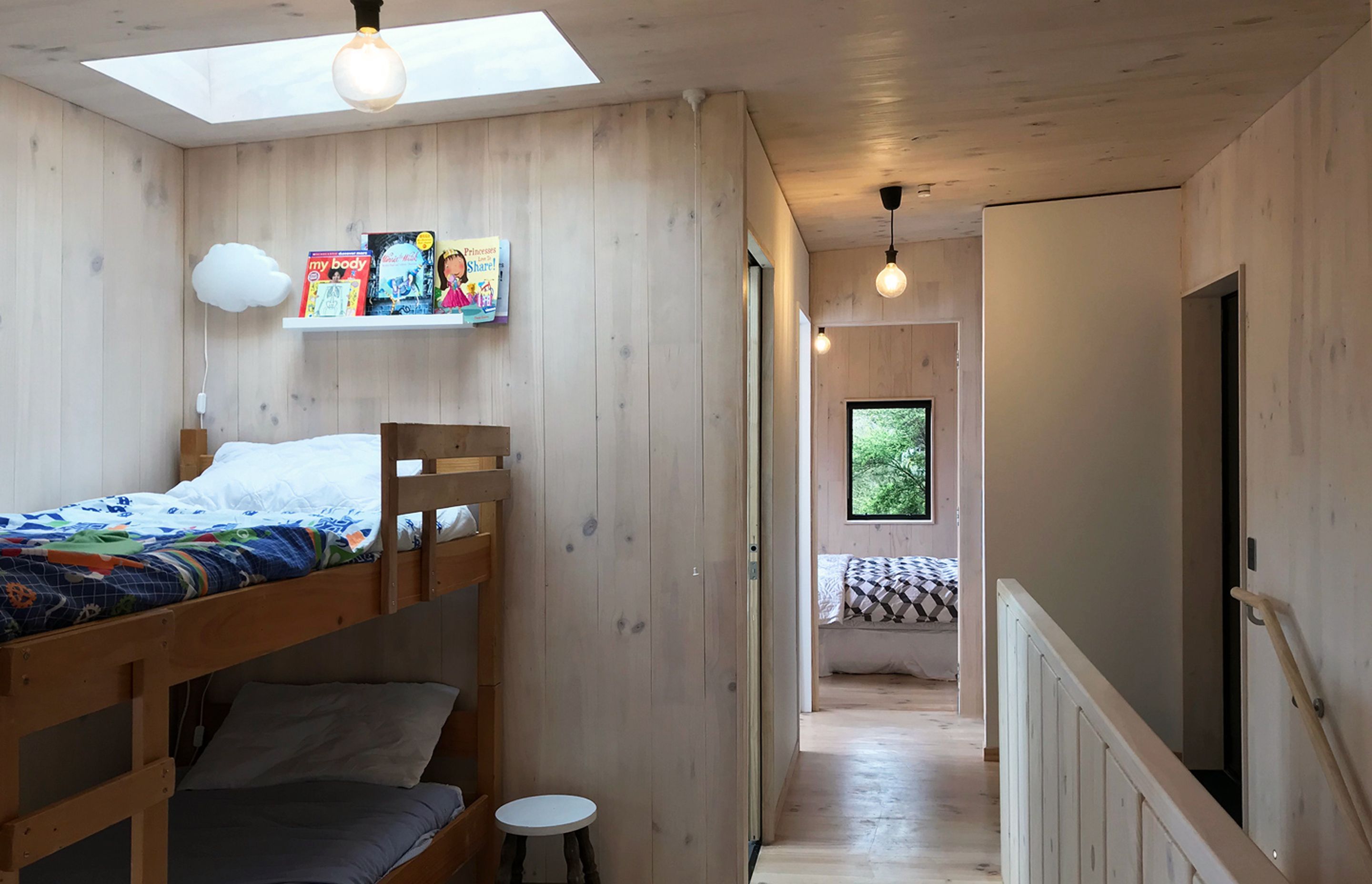 A skylight over the bunk beds offers a view to the stars at night and draws light into the space during the daytime.