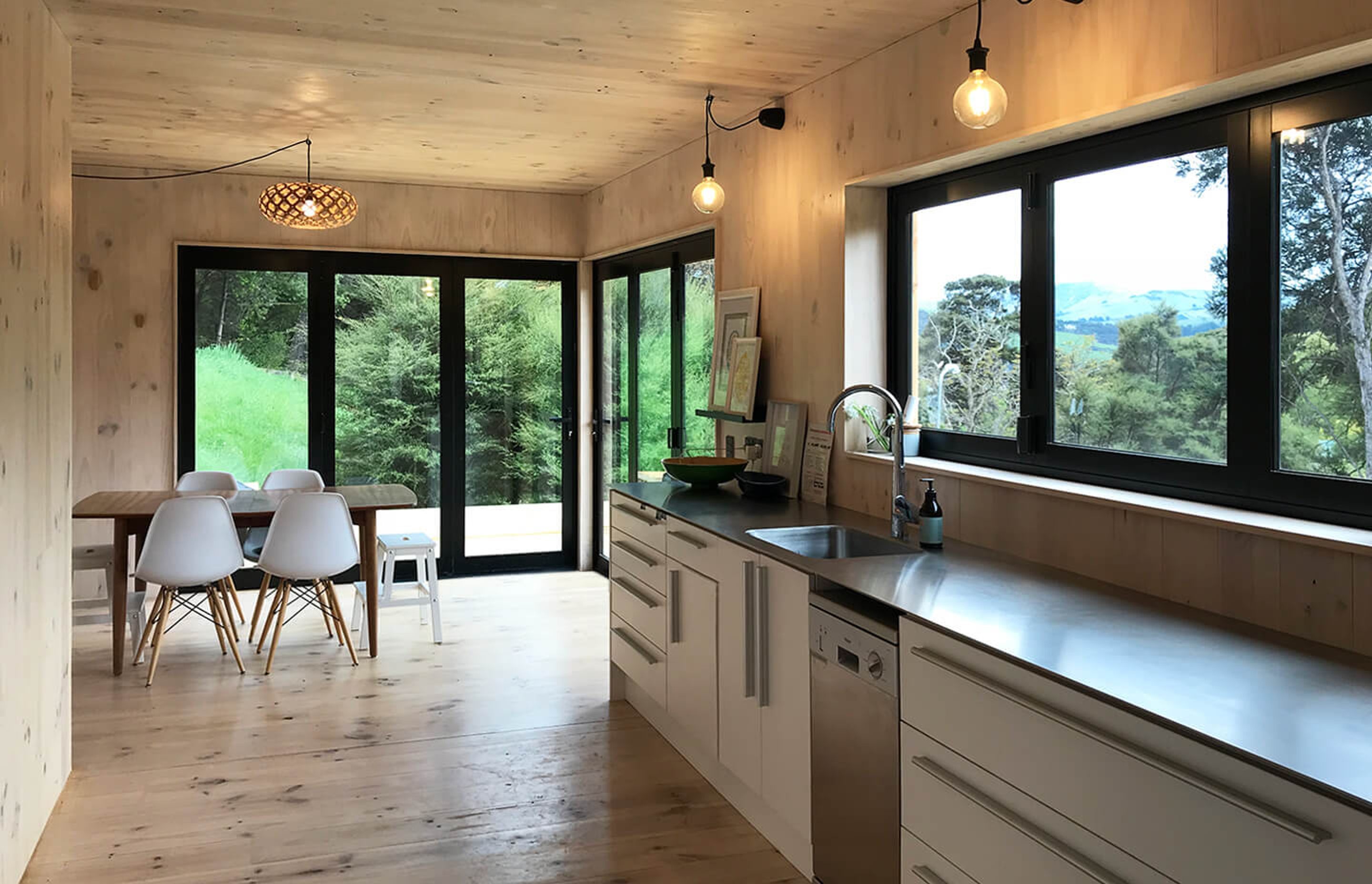 The kitchen and dining space looks out over the valley.