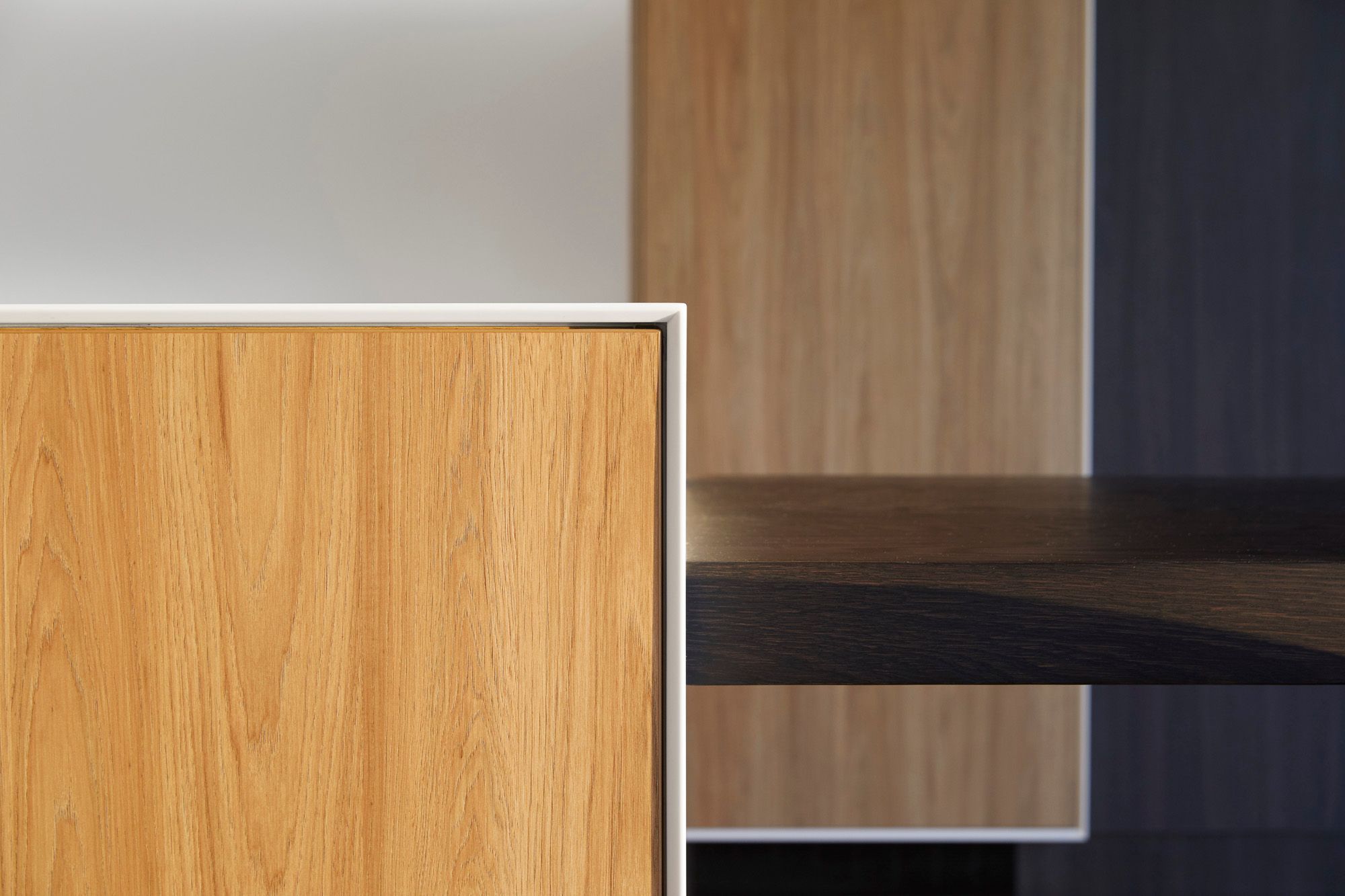 Detail of the 'shark nose' 12 mm think Corian bench top and frame.