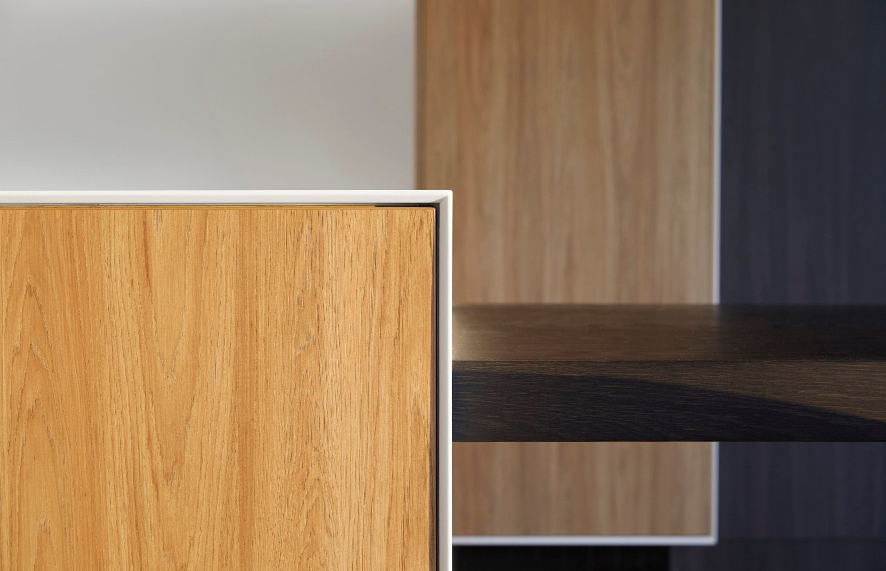 Detail of the 'shark nose' 12 mm think Corian bench top and frame.