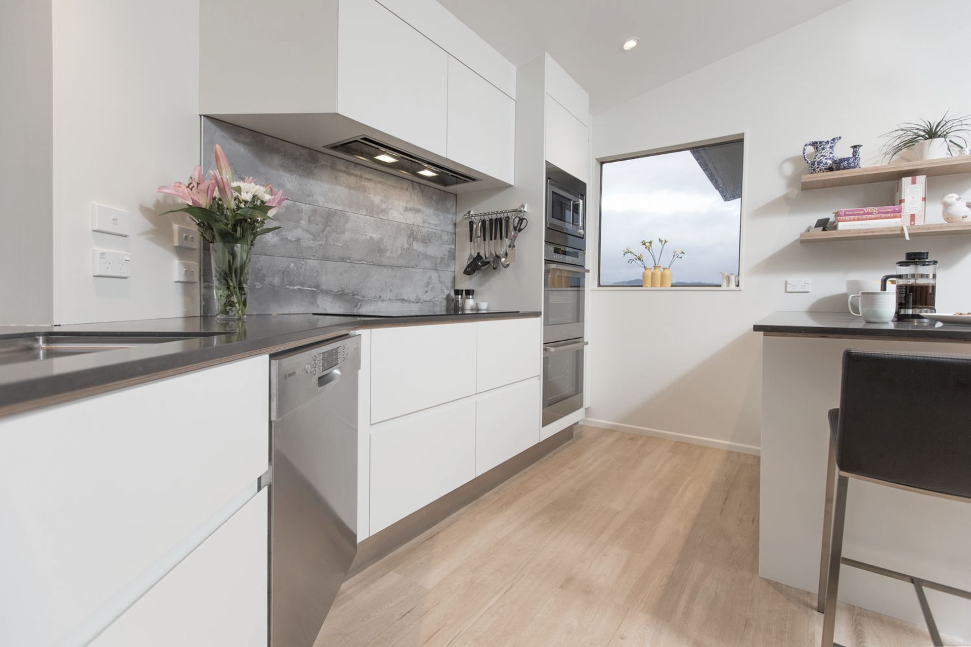 Not a straight wall in sight! The joinery was designed up to the ceiling to make the most of space and streamline the clean bright cabinetry.