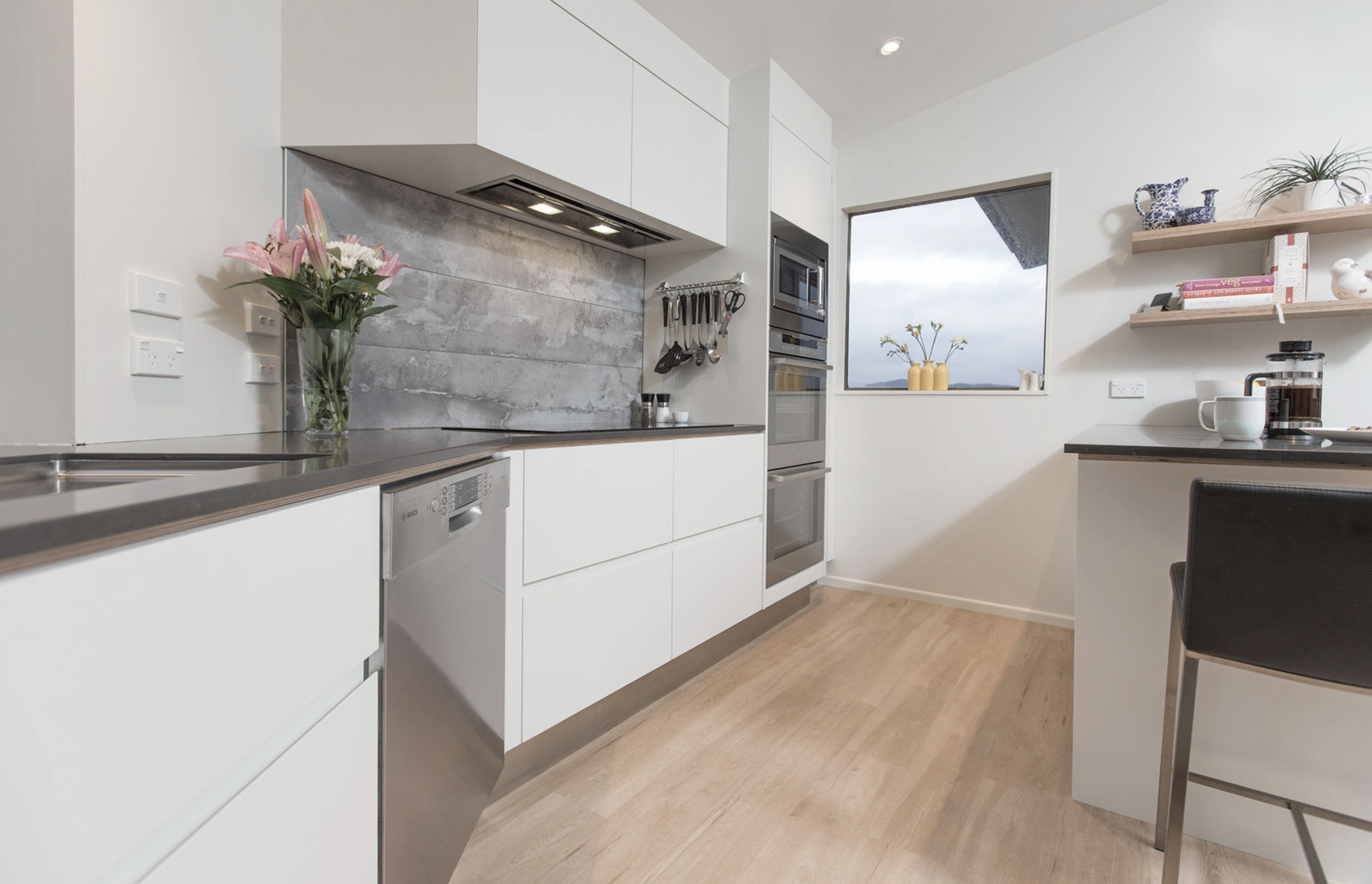 Not a straight wall in sight! The joinery was designed up to the ceiling to make the most of space and streamline the clean bright cabinetry.