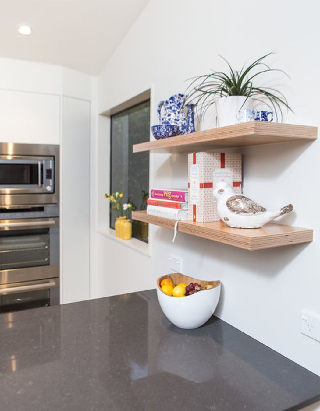 Sweet plywood display shelves above and below bench.