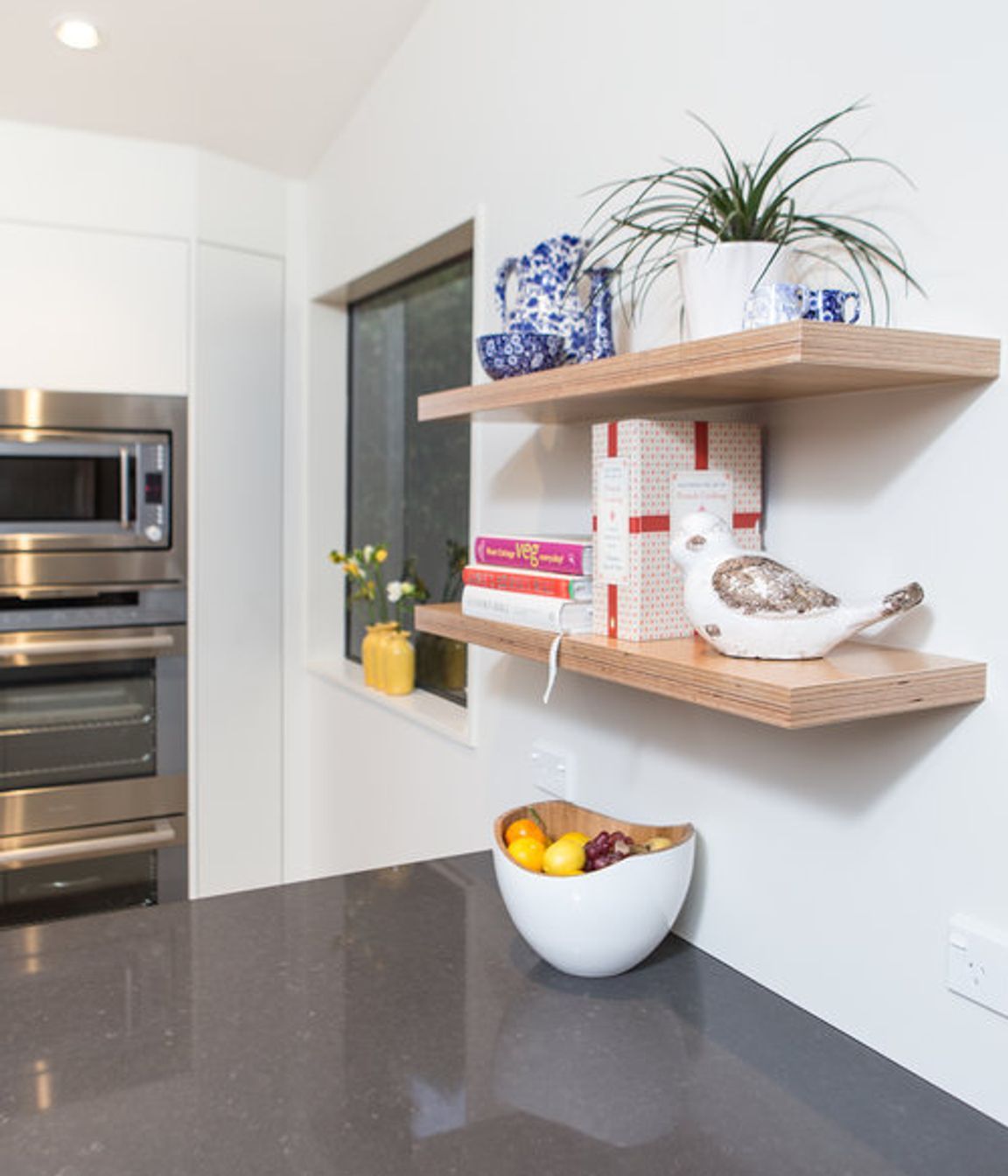 Sweet plywood display shelves above and below bench.