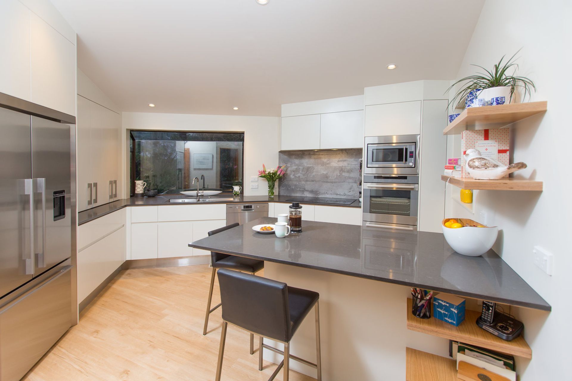 Clean and streamlined finish in this kitchen, with generous workspace and high end appliances.