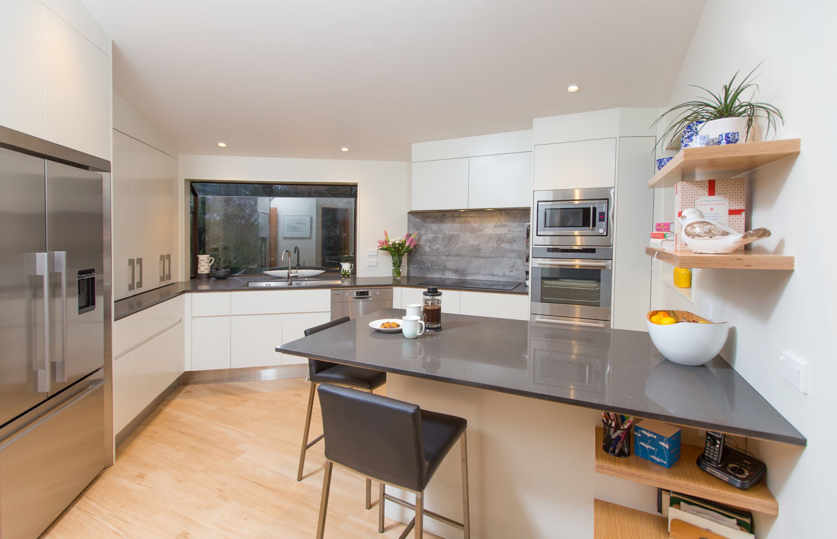 Clean and streamlined finish in this kitchen, with generous workspace and high end appliances.