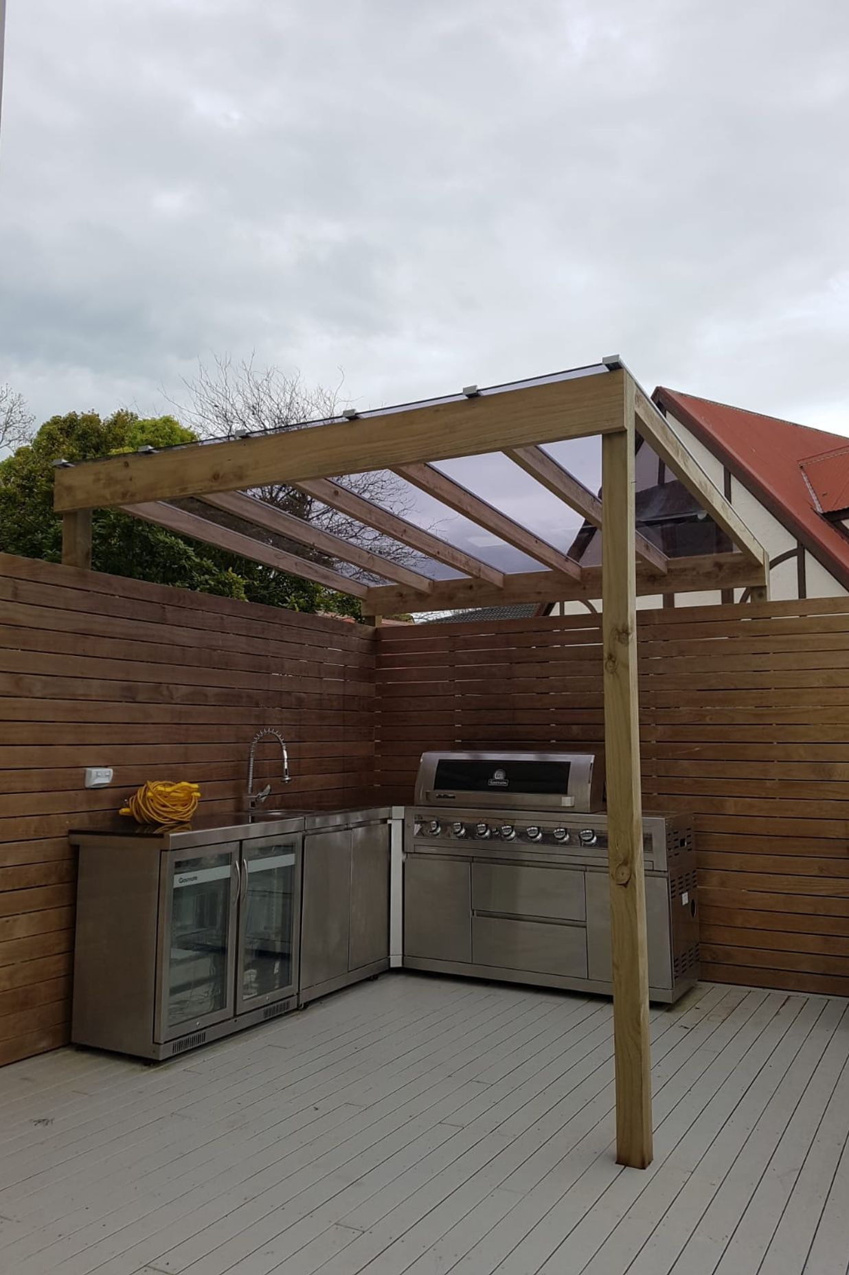  New clear roof over outdoor kitchen.