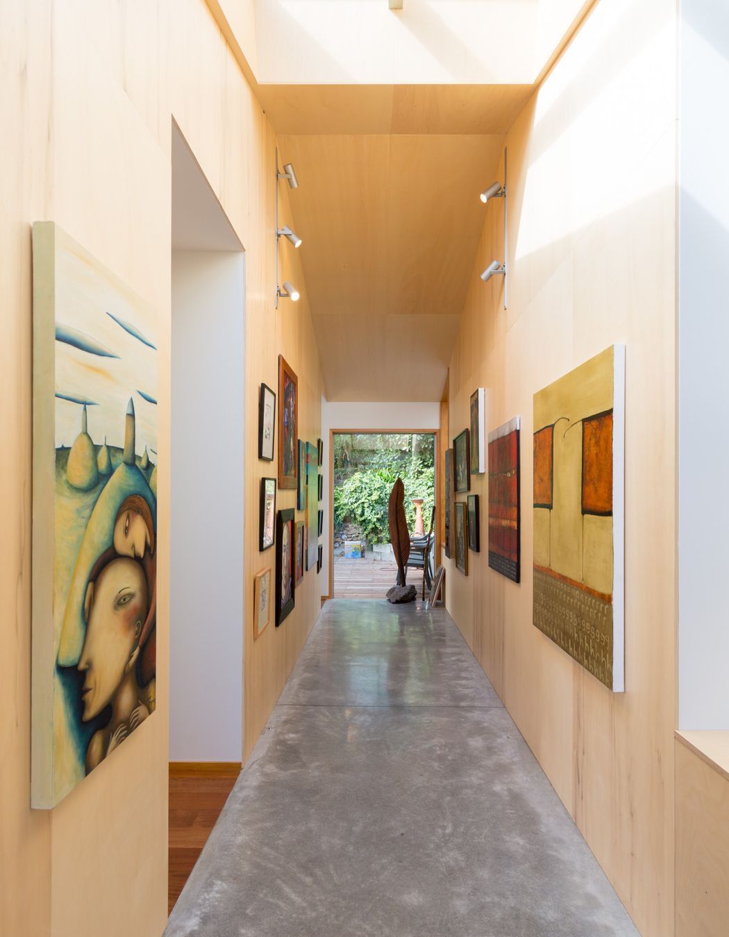 The entryway opens onto a gallery space, with the open-plan living situated to the left and access two the new double-storey extension to the right.