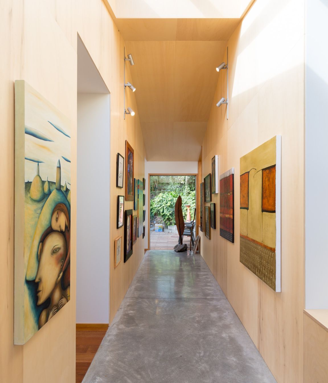 The entryway opens onto a gallery space, with the open-plan living situated to the left and access two the new double-storey extension to the right.
