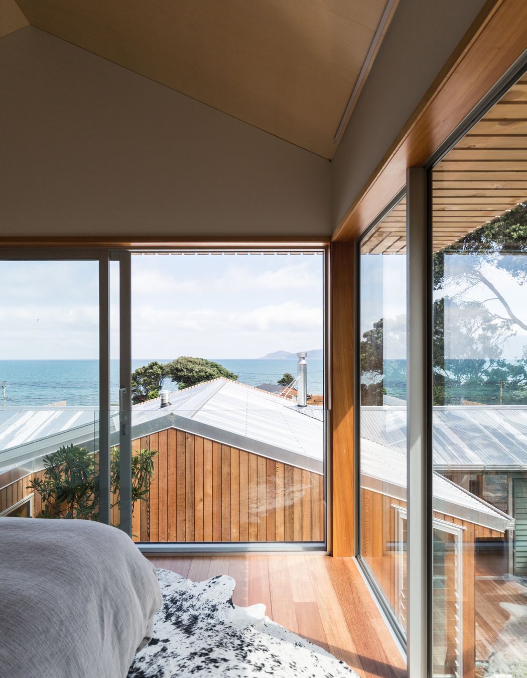 The new master bedroom has enviable views out over the coast and towards Kapiti Island.