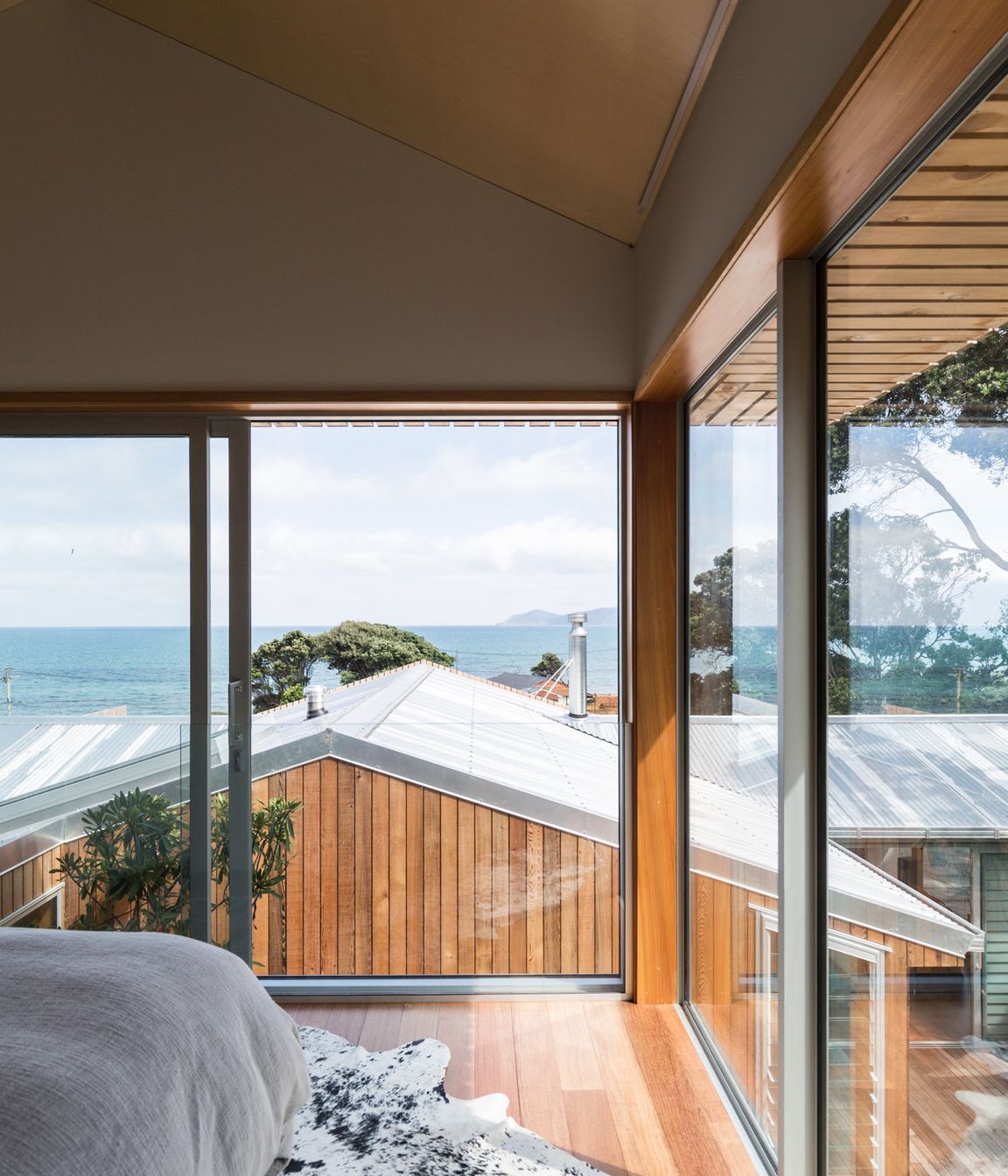 The new master bedroom has enviable views out over the coast and towards Kapiti Island.