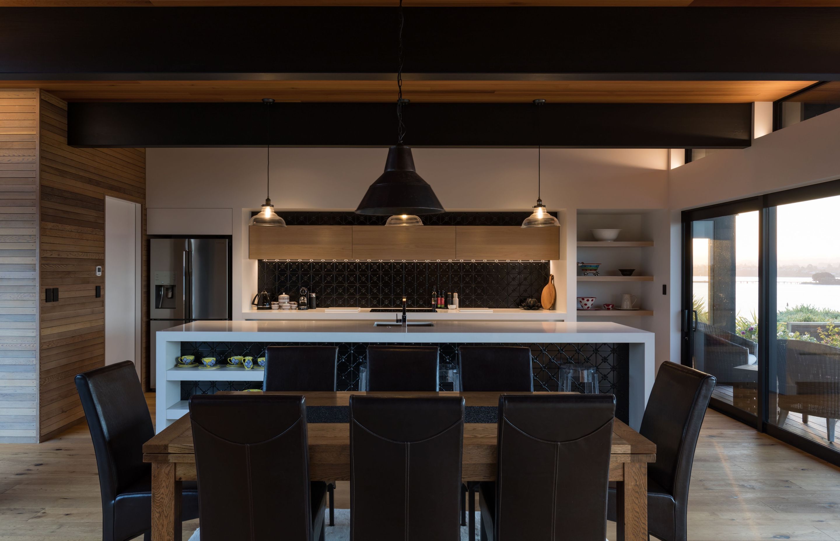The hub of the house, the kitchen, with a bit of texture and drama with its pressed metal accents and bespoke lighting.