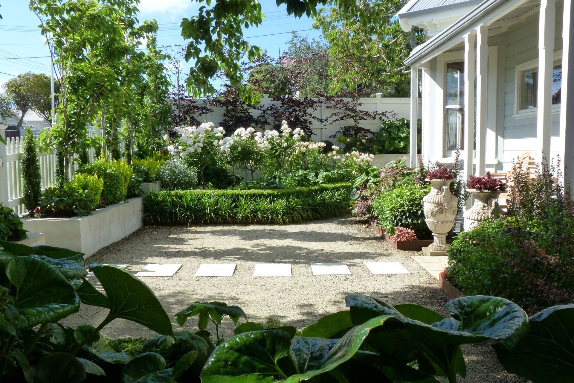 The front garden used to be a sloping lawn, and we levelled, retained, fenced and re-surfaced it.