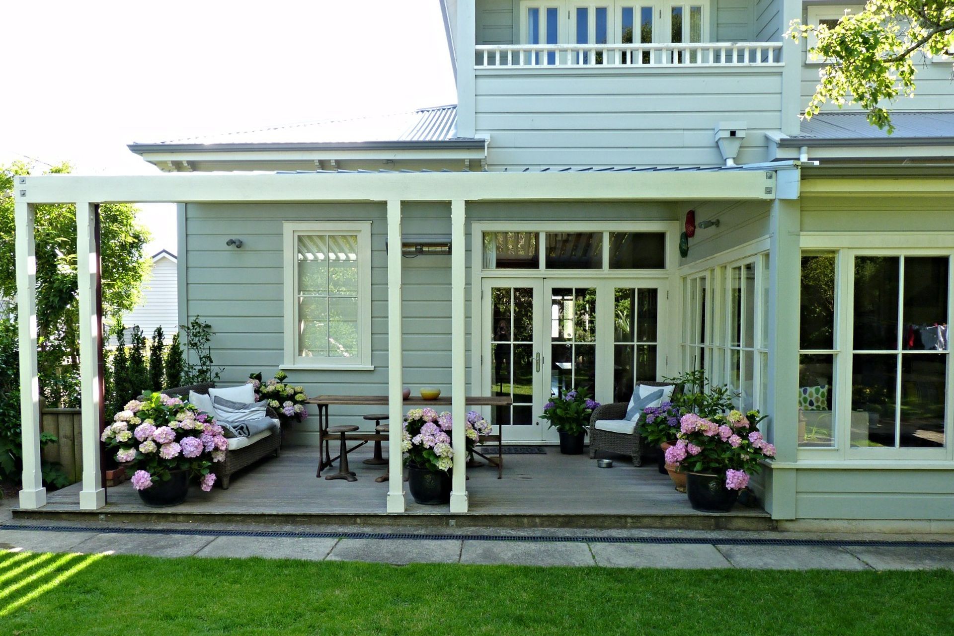 Family outdoor living on the verandah in the back garden