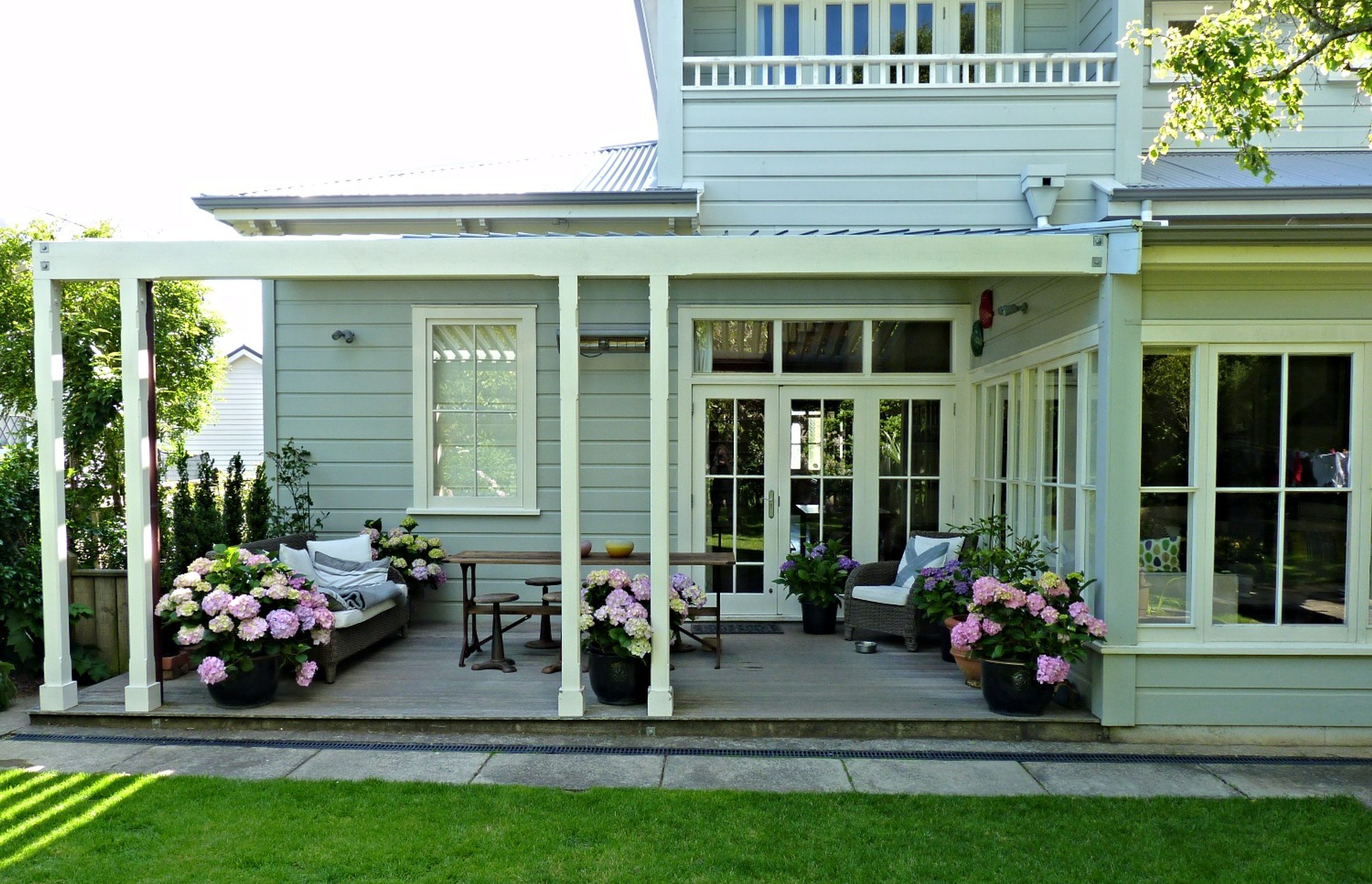 Family outdoor living on the verandah in the back garden