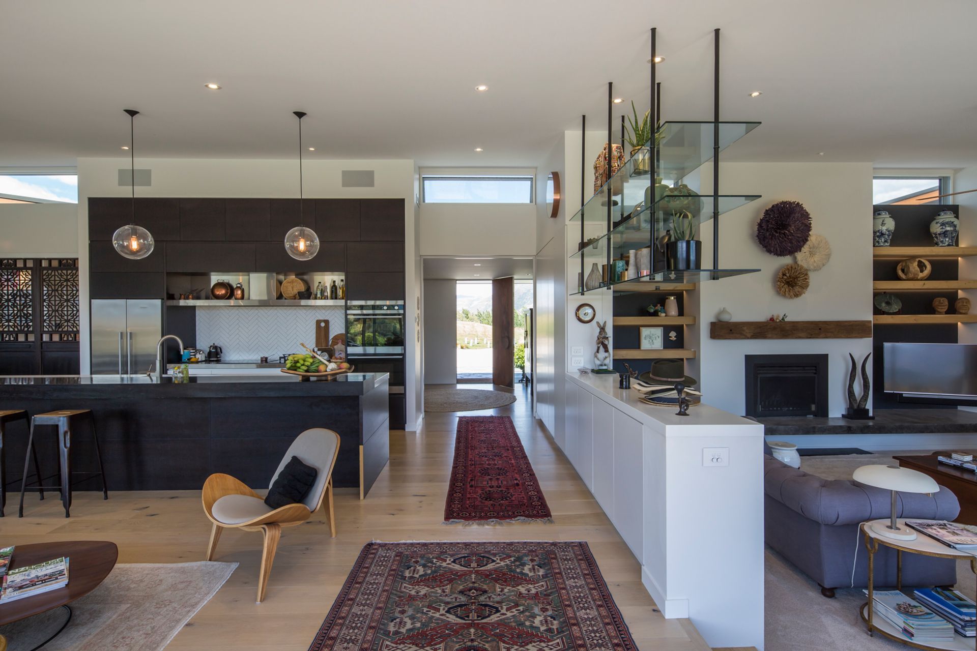 The main living areas are open yet separate thanks to the clever incorporation of built-in elements lending a sense of separation.