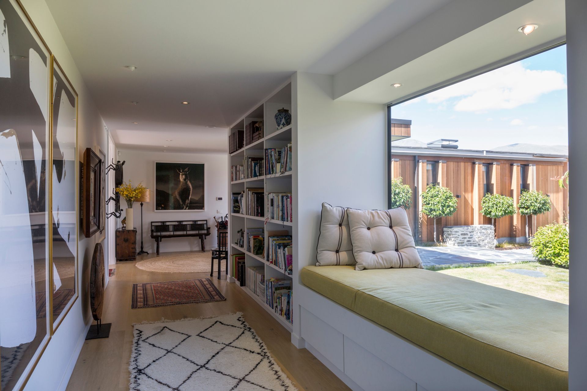 The hallways are wide enough that they can be used as another space rather than just circulation corridors, coupled with the window seat, this area makes for a cosy reading nook.