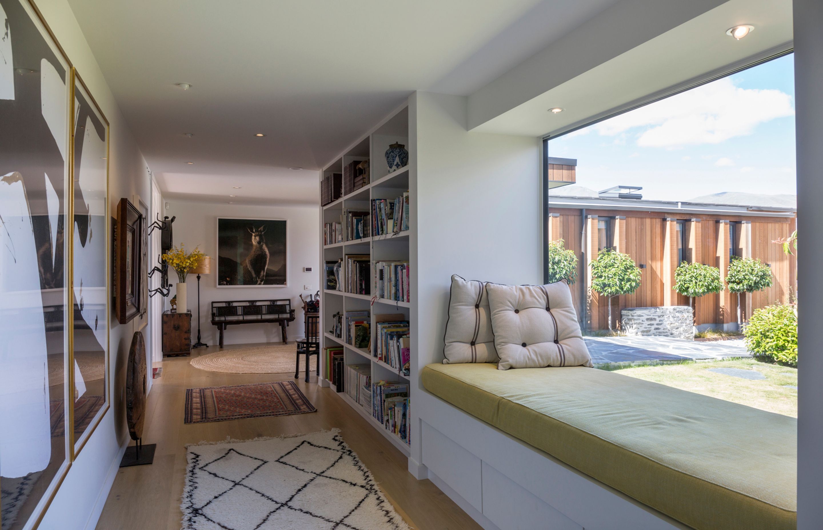 The hallways are wide enough that they can be used as another space rather than just circulation corridors, coupled with the window seat, this area makes for a cosy reading nook.