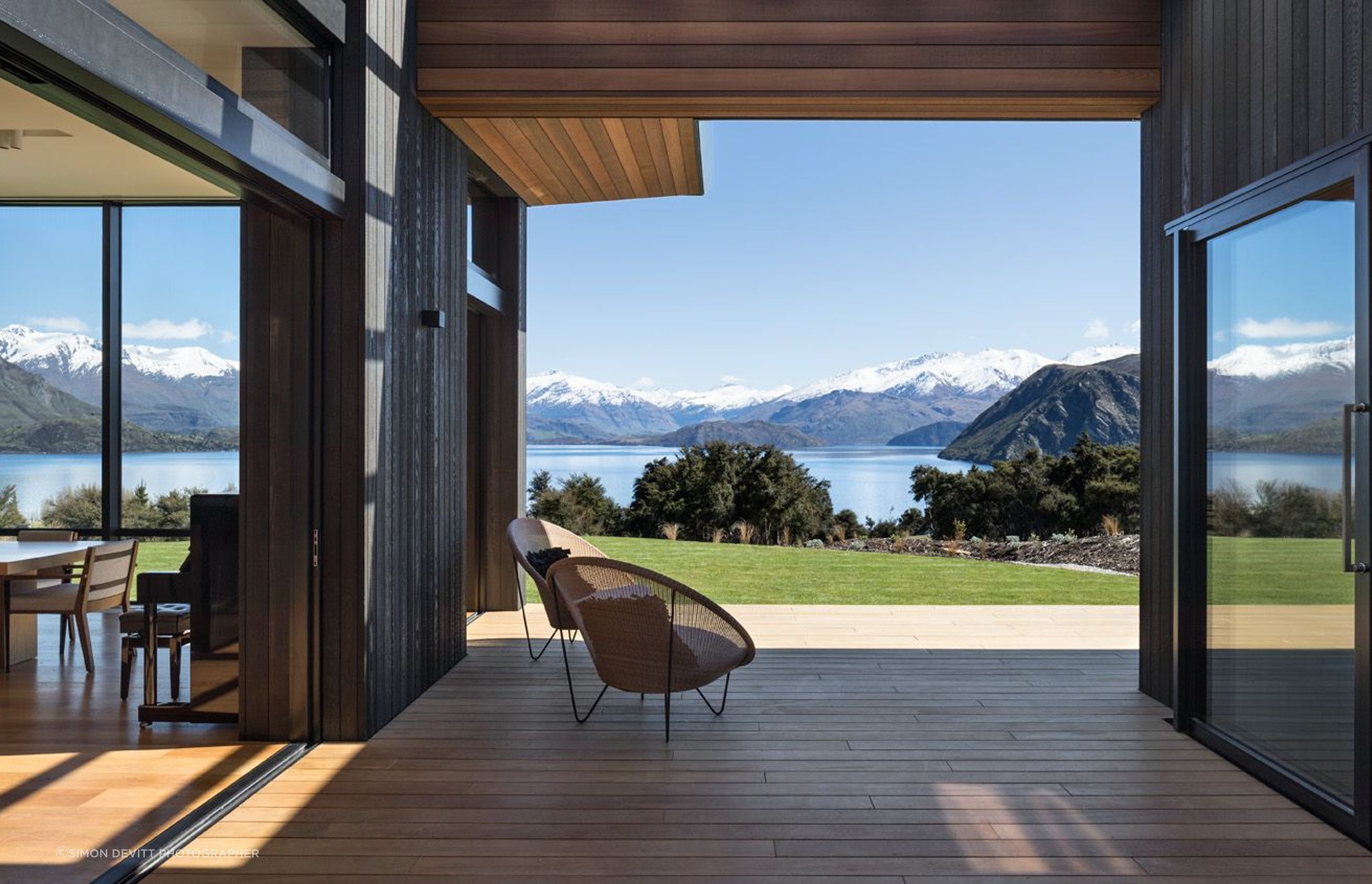 Corner openings, surface sliders, and pocket sliding doors re-shape rooms to extend their boundaries.