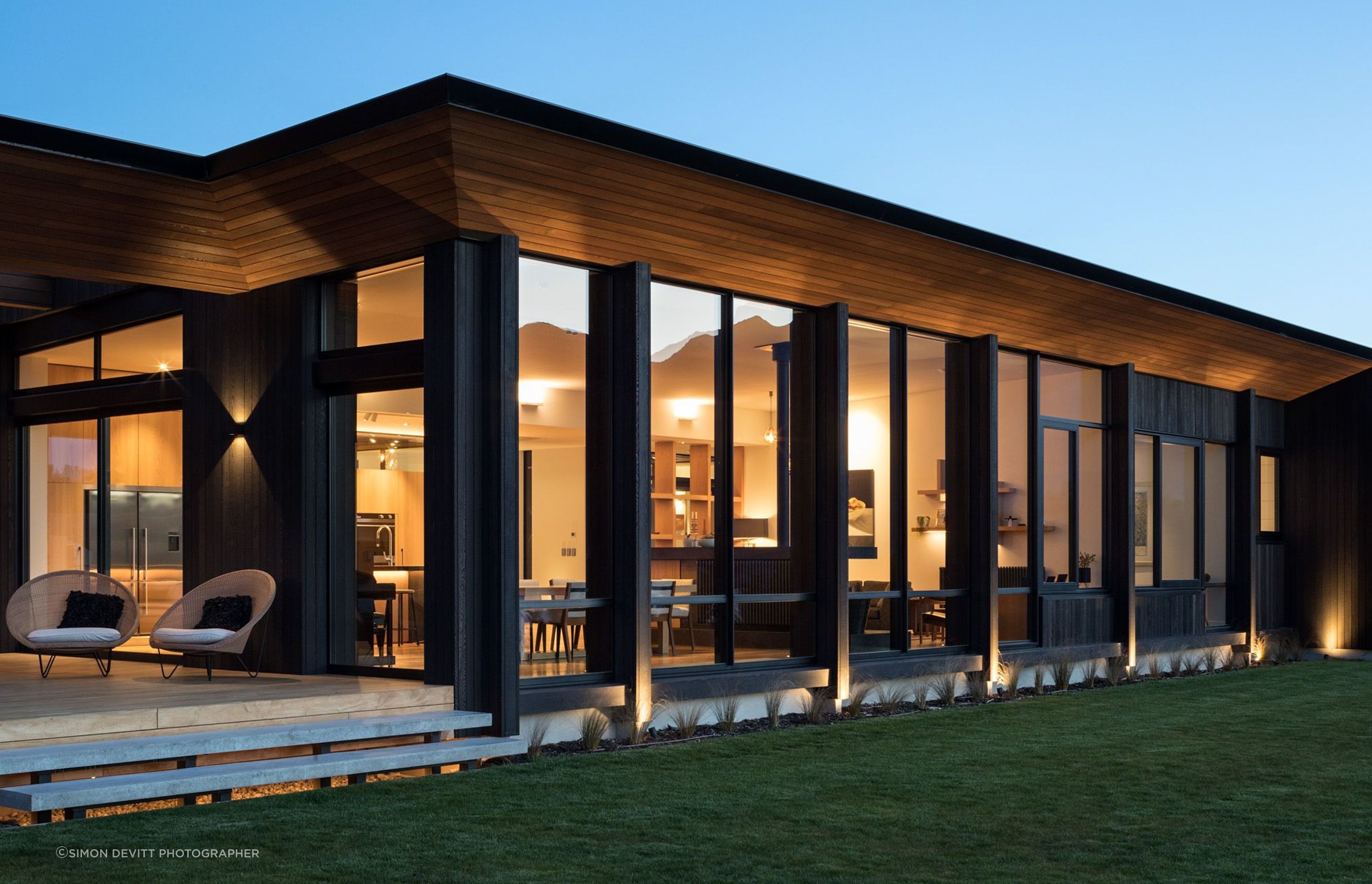 A cedar soffit wraps around the edge of the roof.