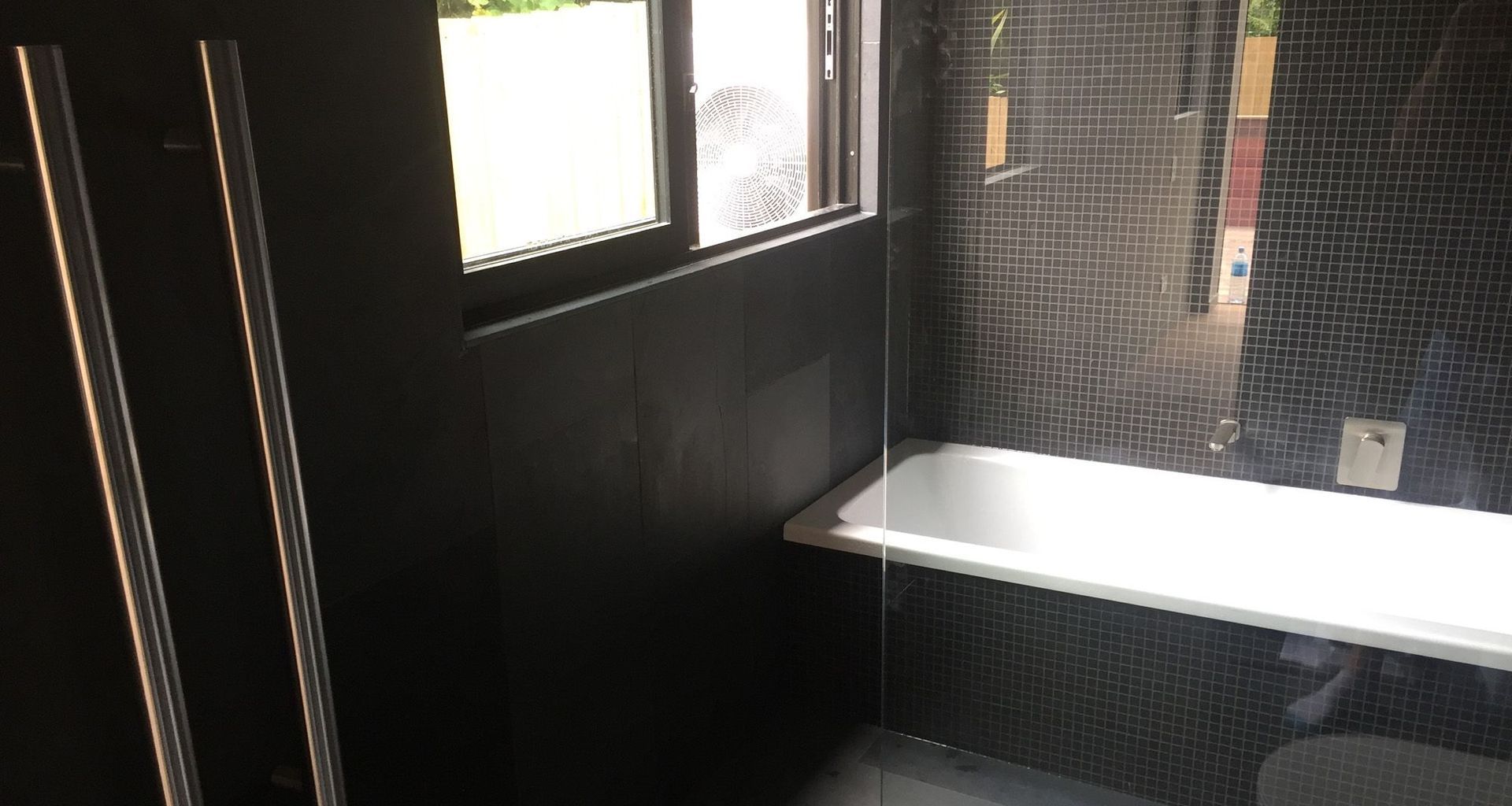Black Tiled Bathroom banner