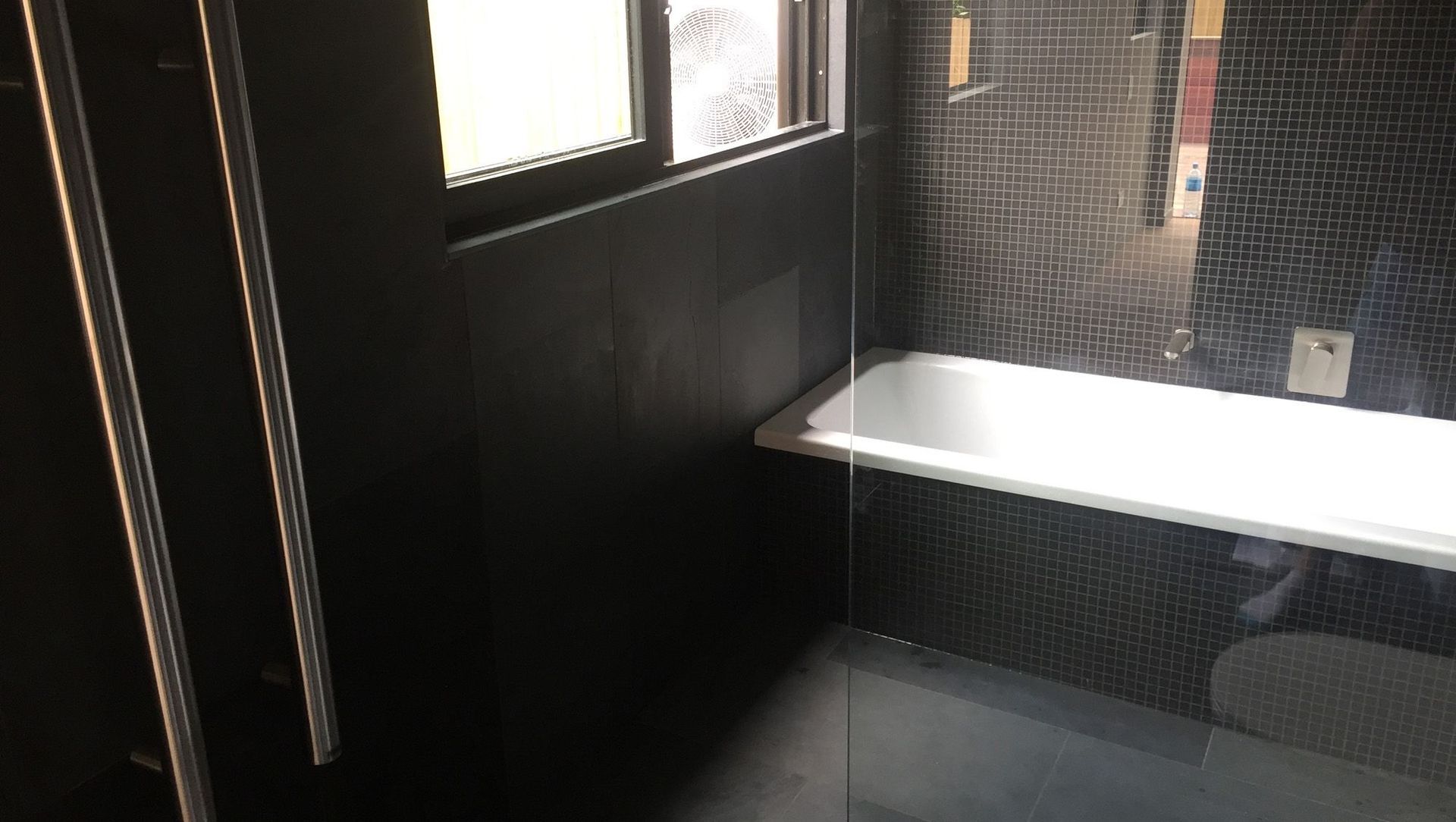 Black Tiled Bathroom banner