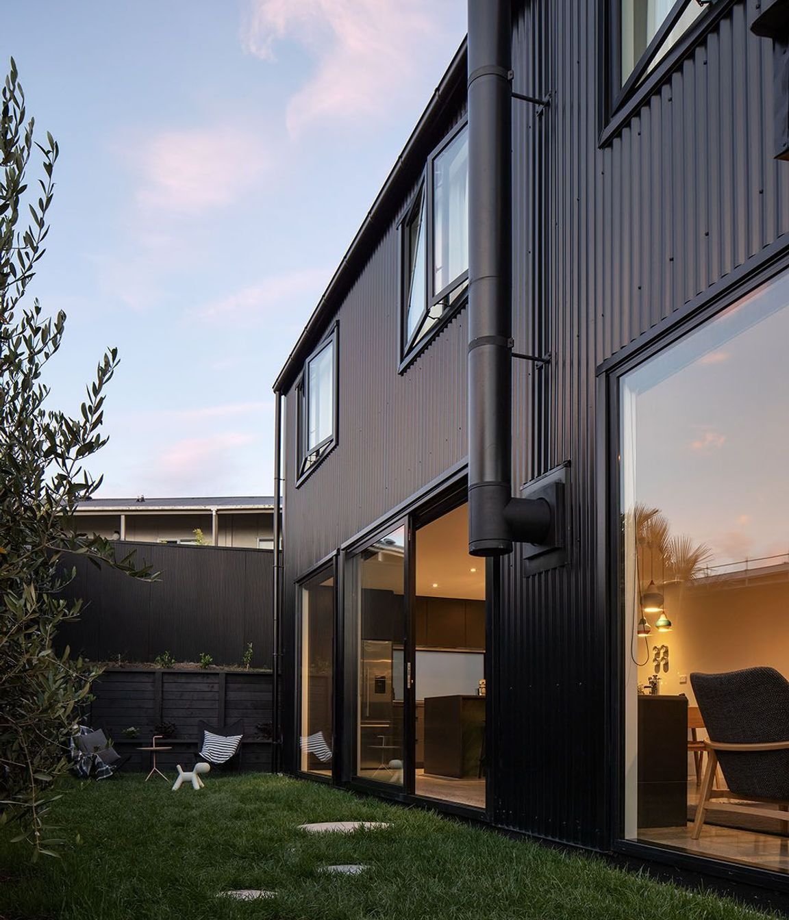 The side of the house connects with the ground-floor spaces.