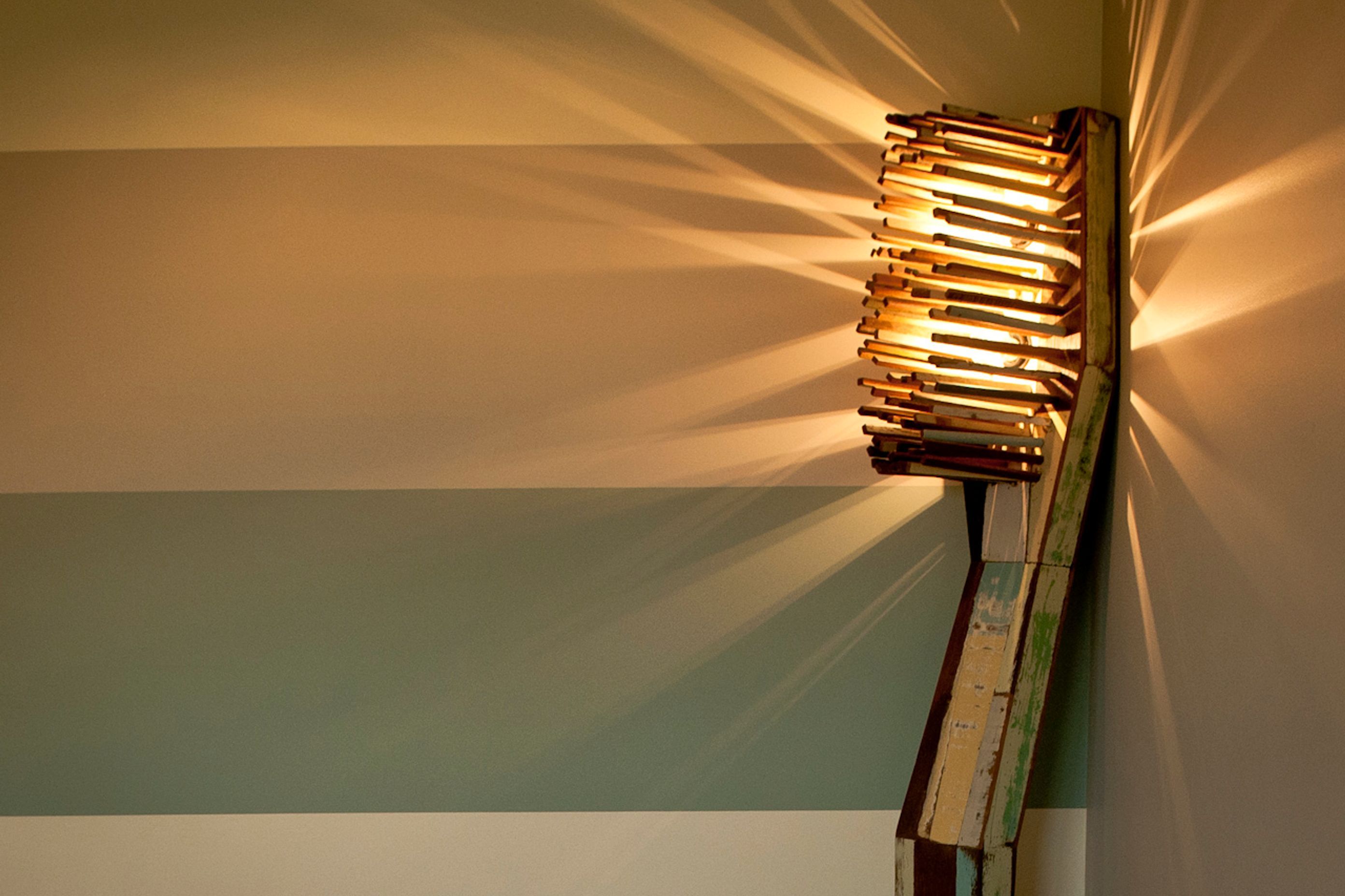 The colours in the Toothbrush standard lamp are painted in stripes on the walls that lead down the two hallways to the main surgery
