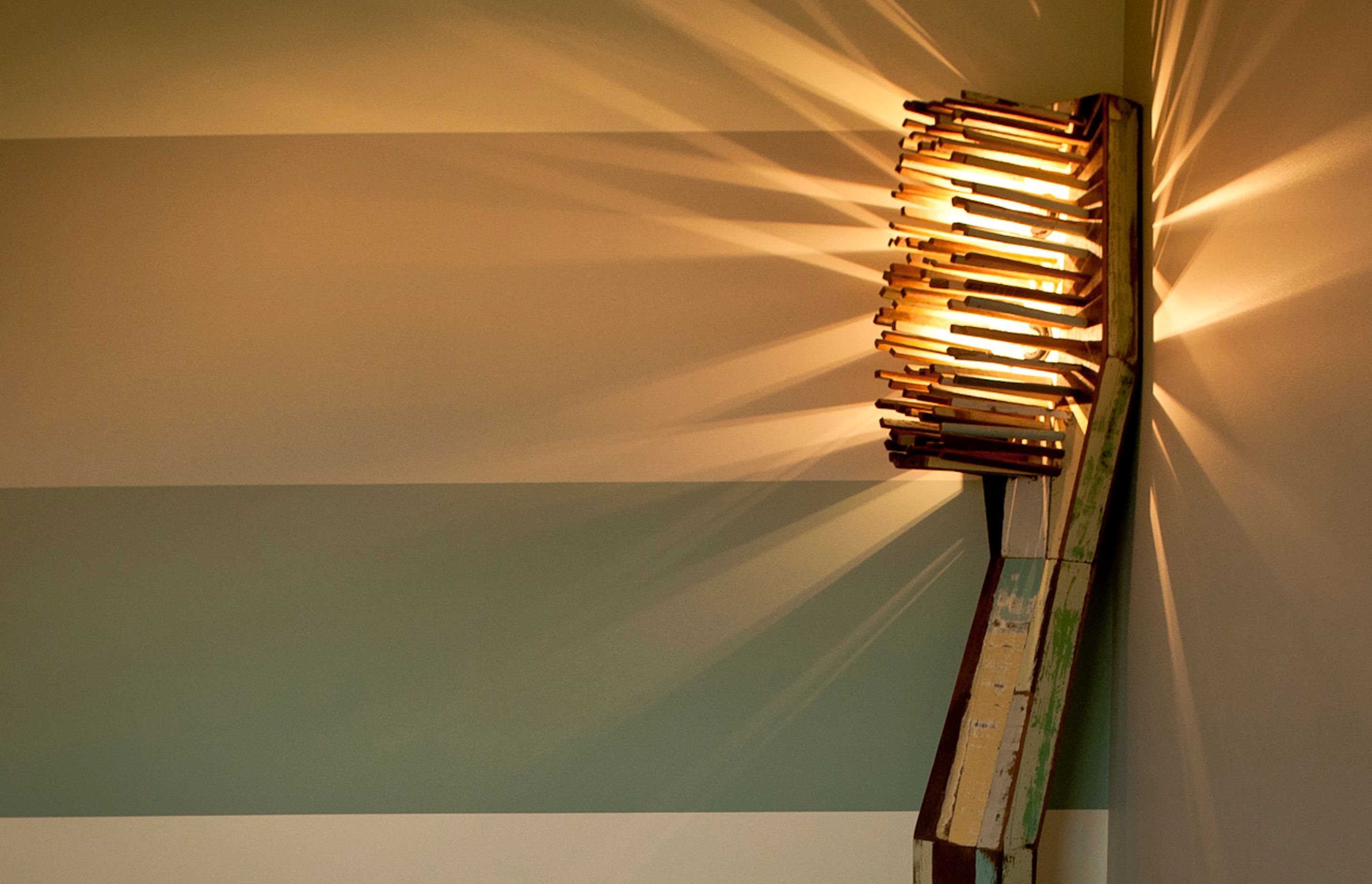 The colours in the Toothbrush standard lamp are painted in stripes on the walls that lead down the two hallways to the main surgery