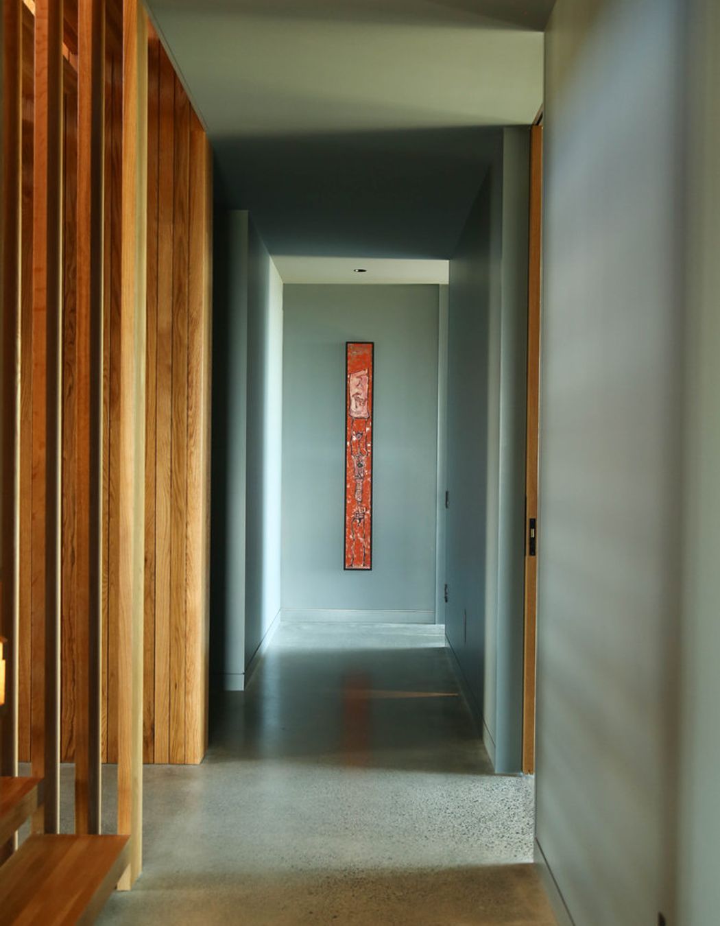 The lower level corridor, seen from the bottom of the staircase.