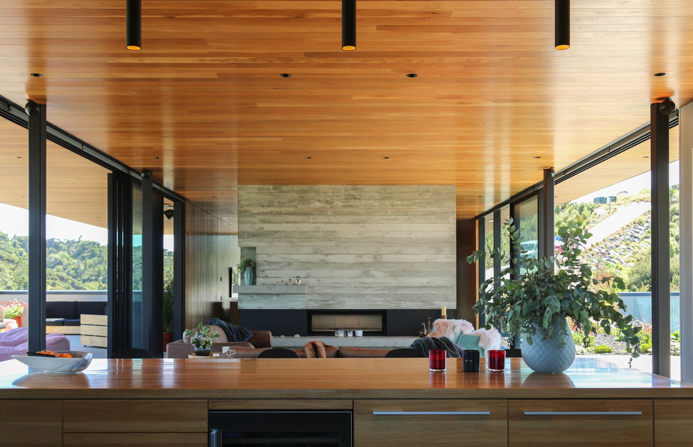 An in-situ concrete dividing wall incorporates a fireplace