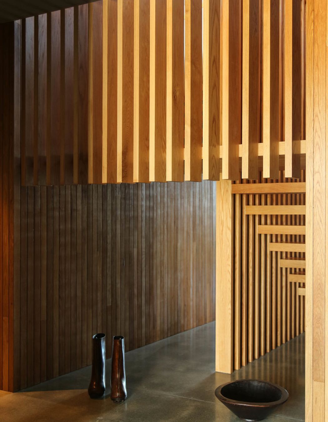 The gallery space under the timber staircase.