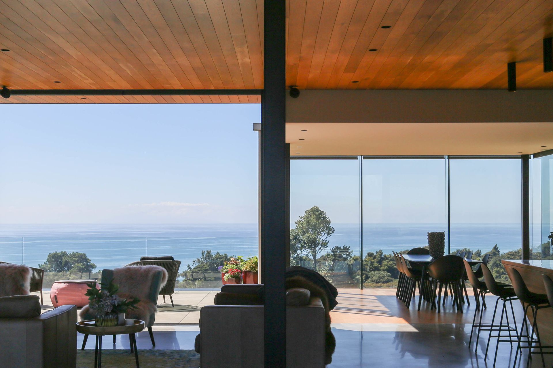 The open-plan kitchen, dining and lounge area opens rights up to the outdoor entertaining area.