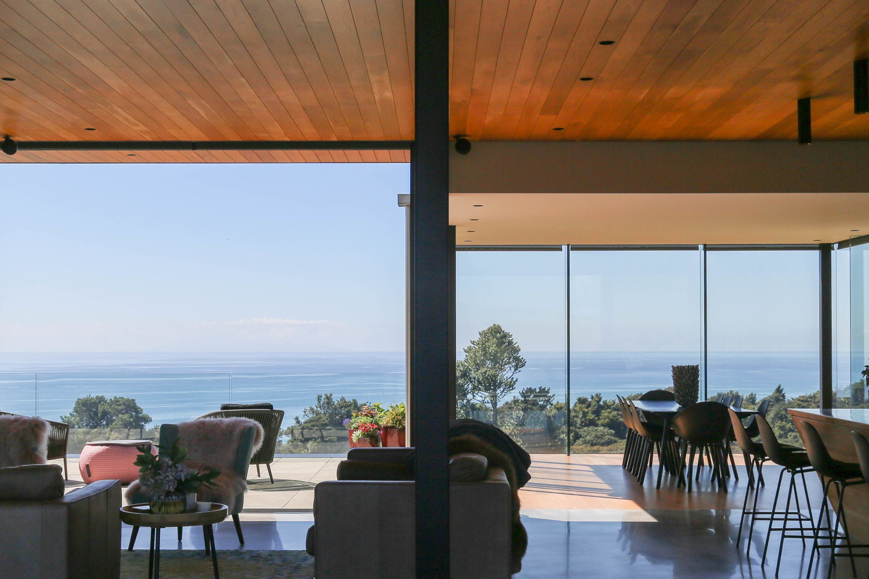 The open-plan kitchen, dining and lounge area opens rights up to the outdoor entertaining area.